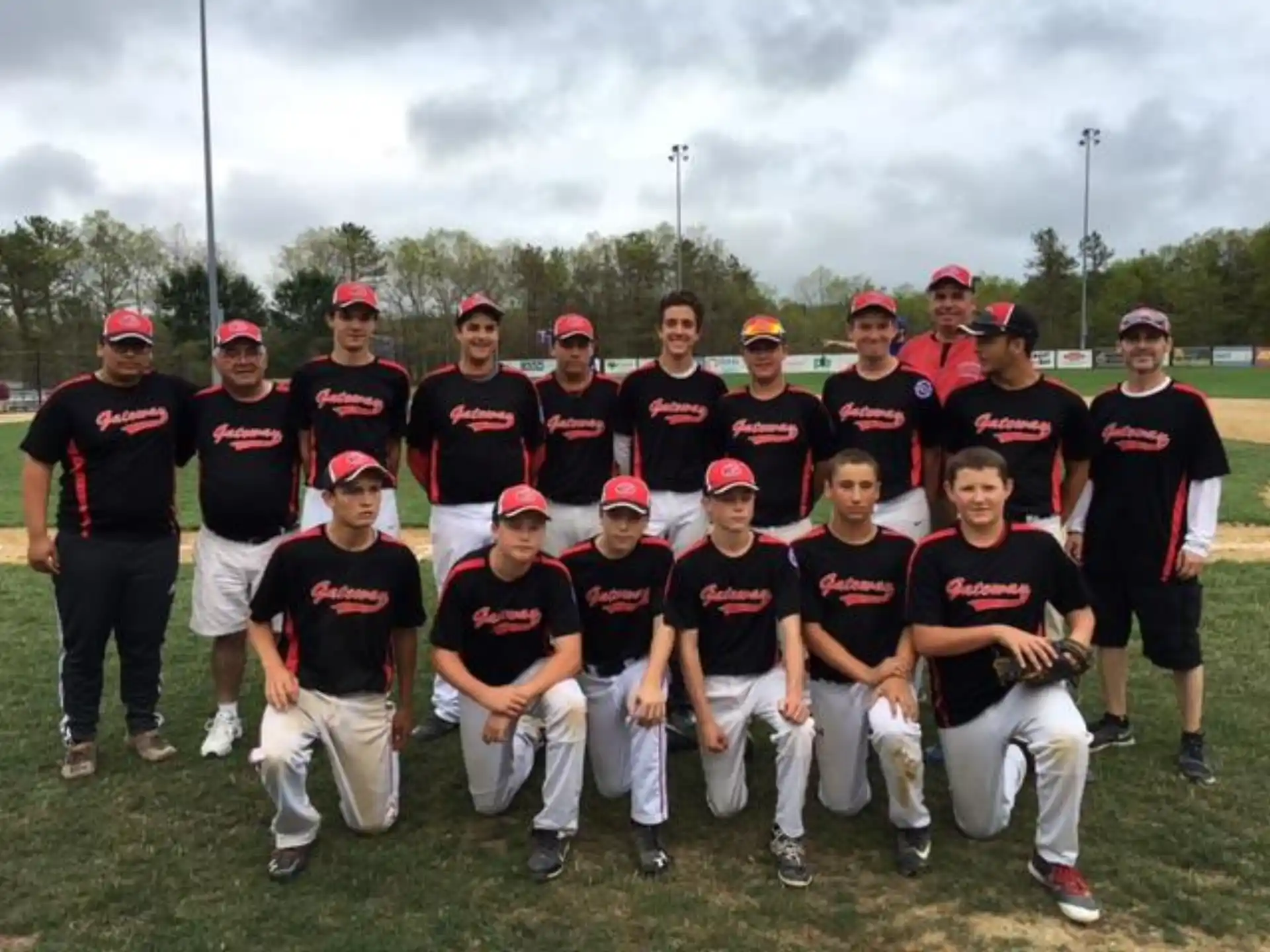 a group of baseball players posing for a photo