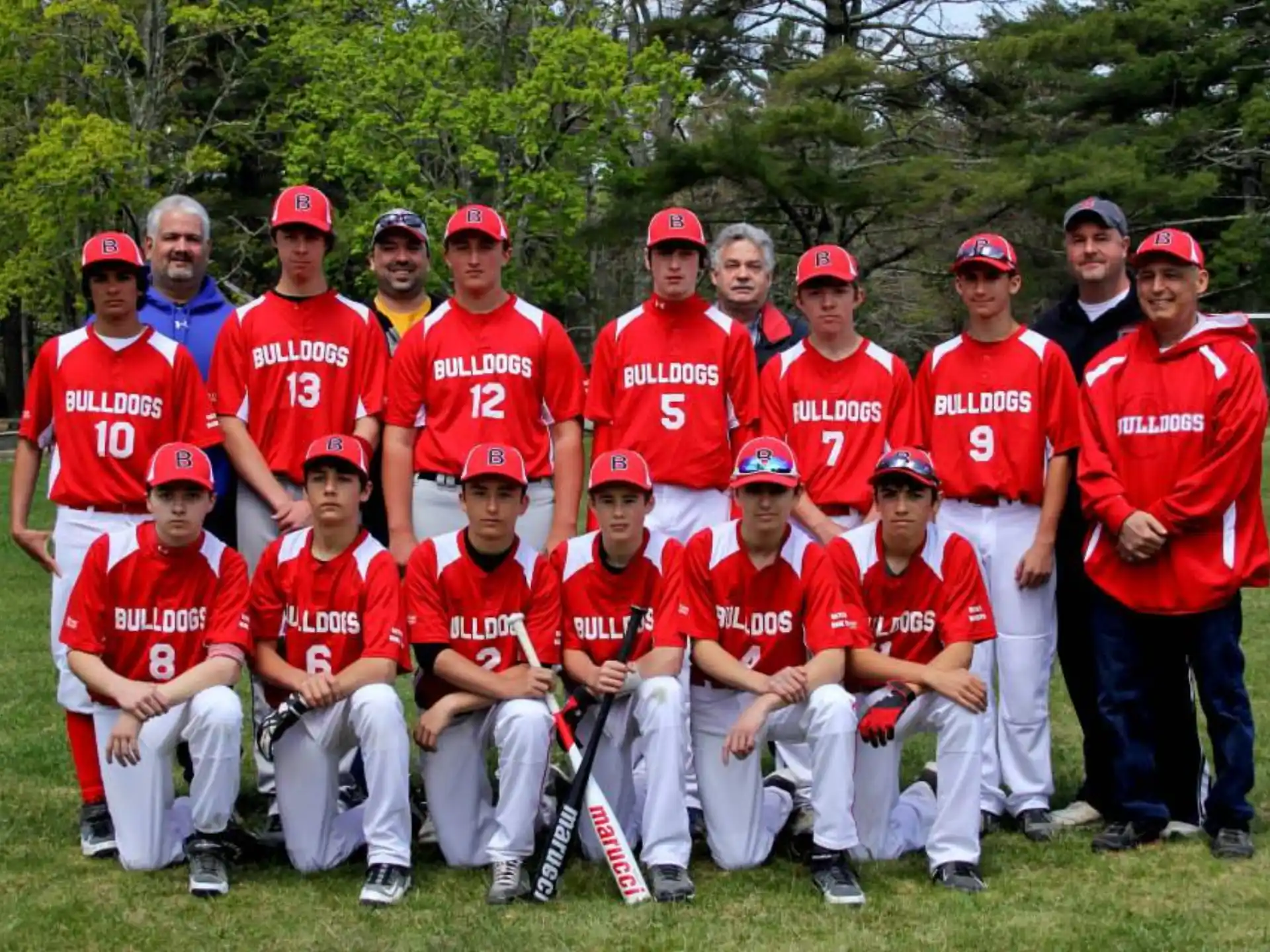 a group of baseball players posing for a photo
