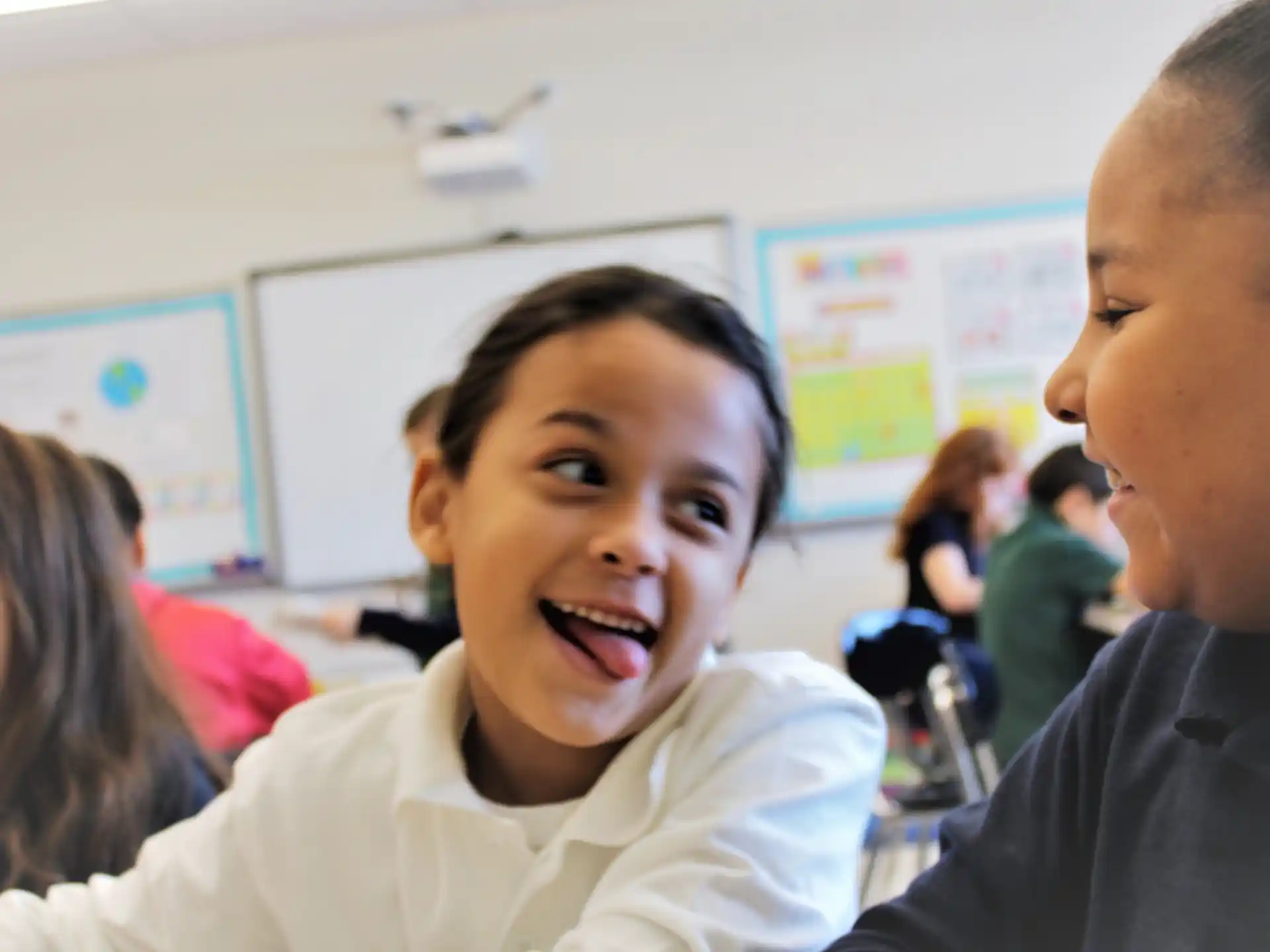 a person and a child in a classroom
