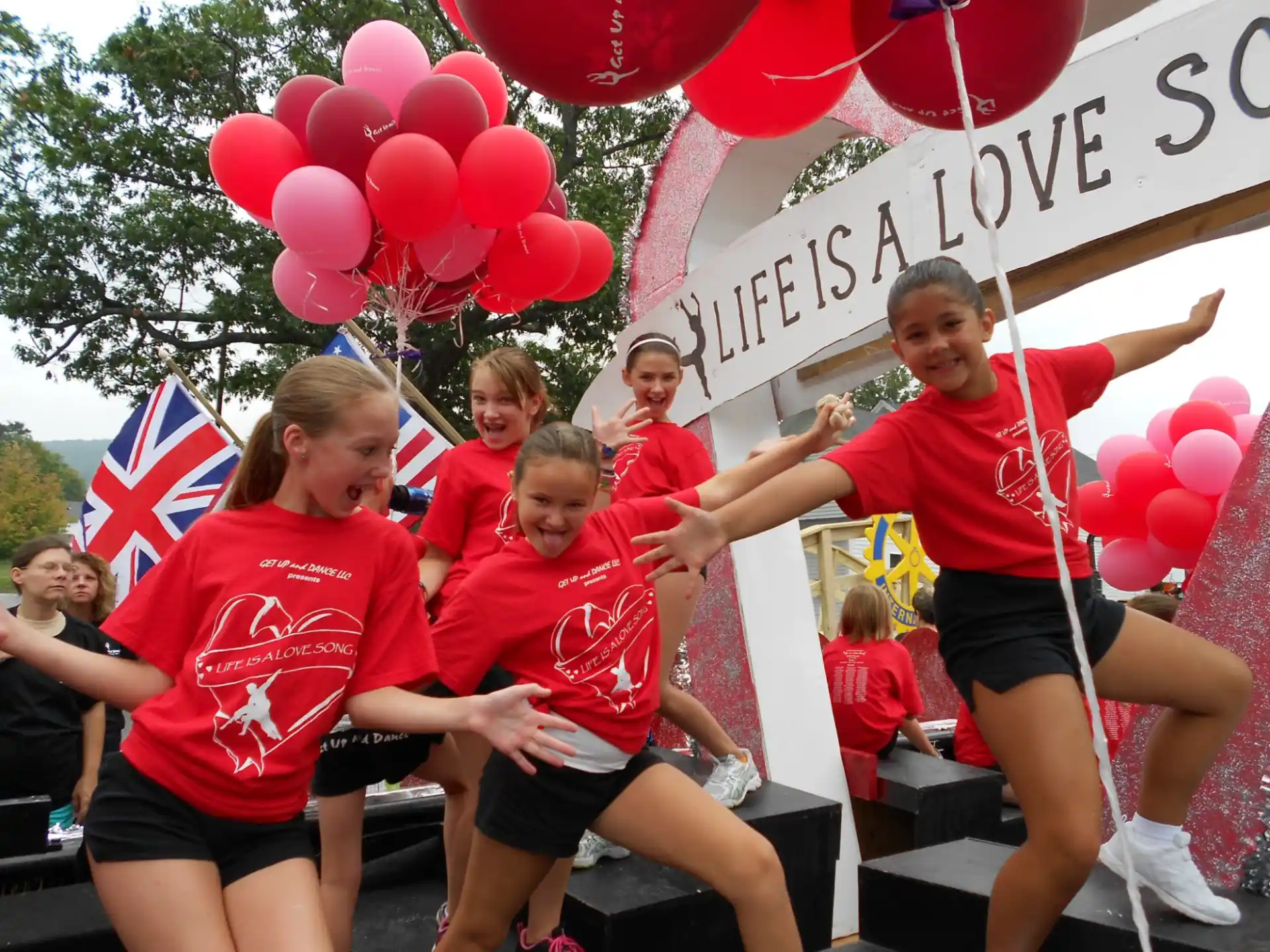a group of people wearing matching t-shirts and running
