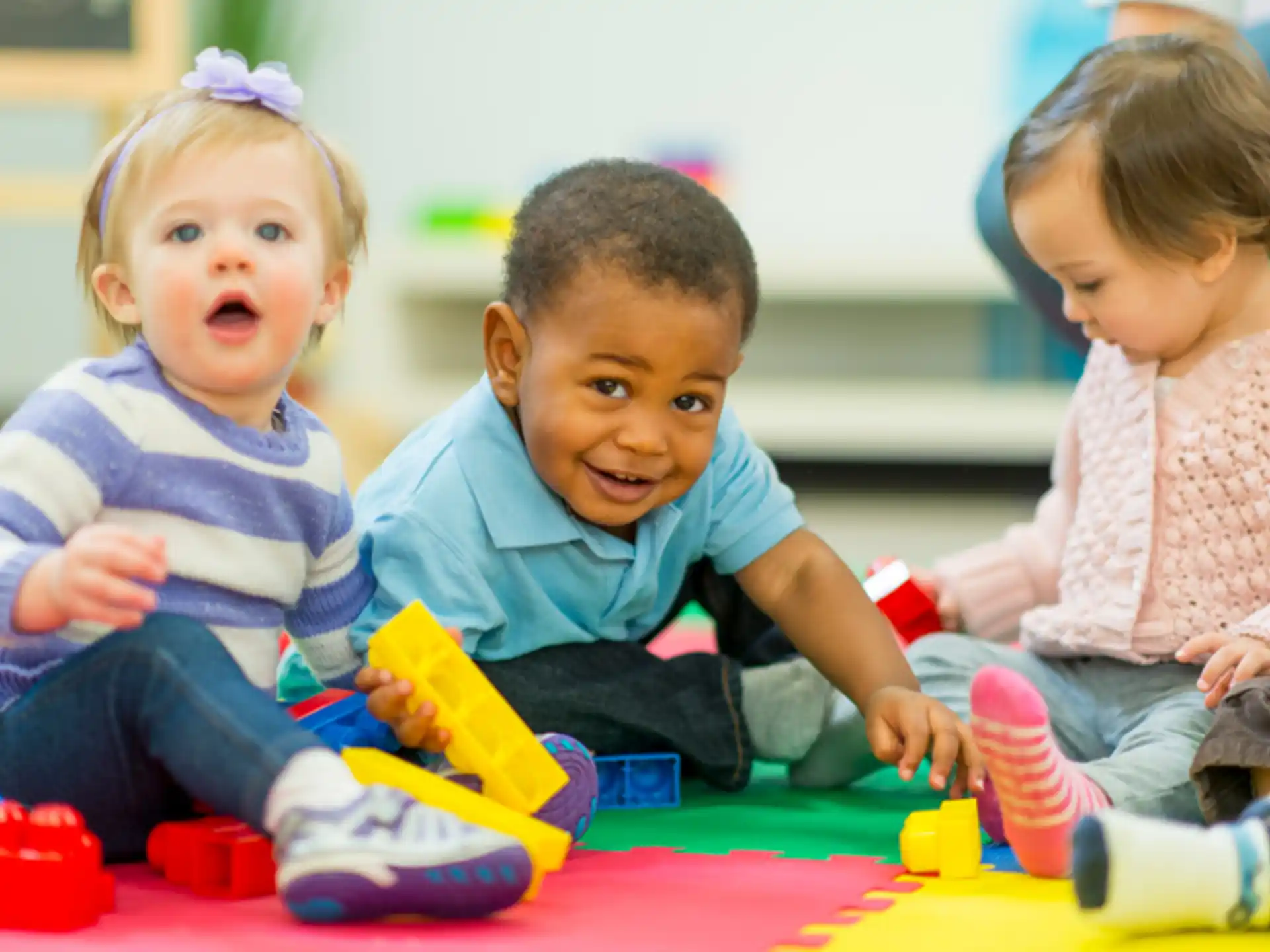 a group of children playing with toys