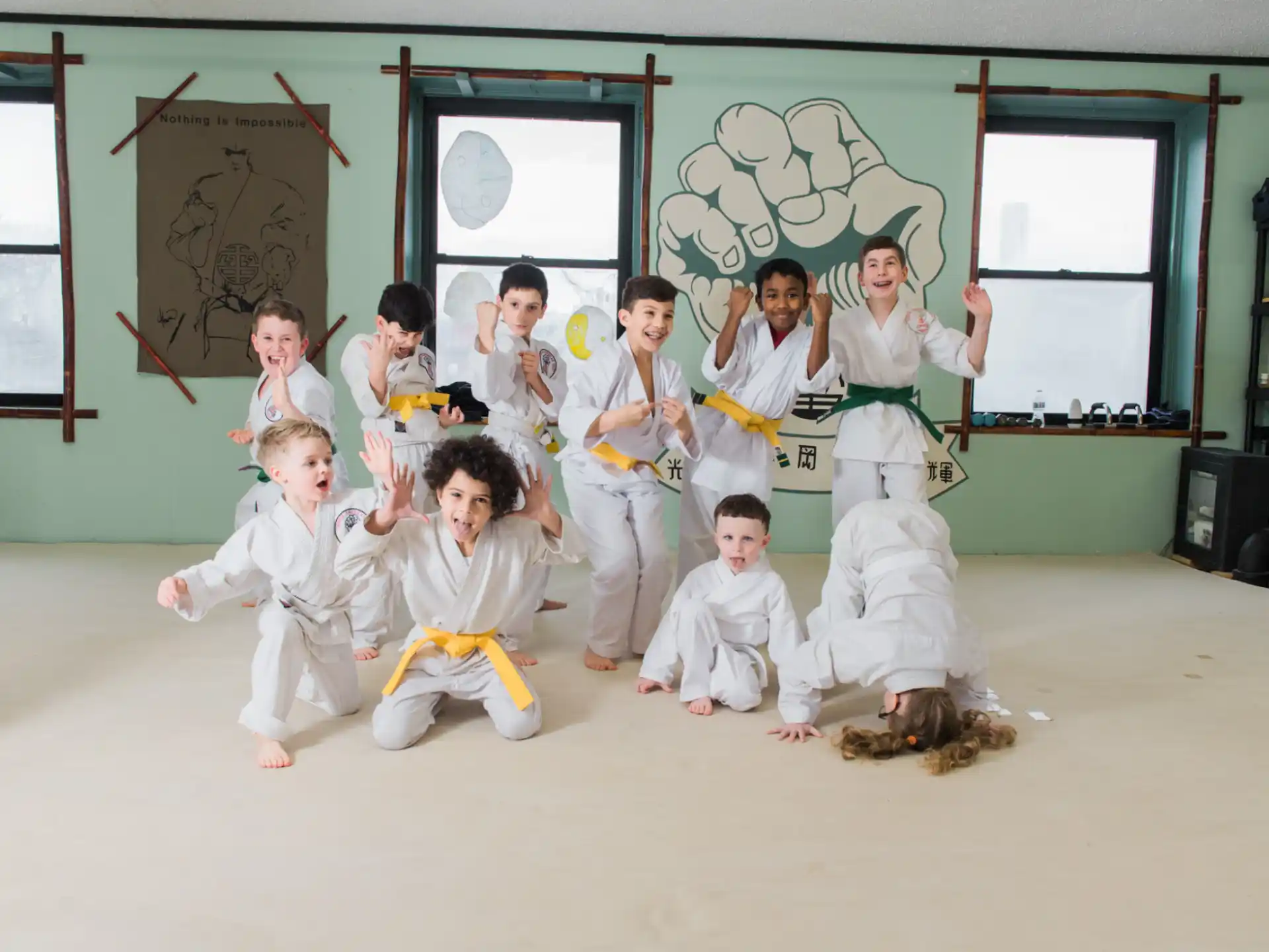 a group of children in karate uniforms
