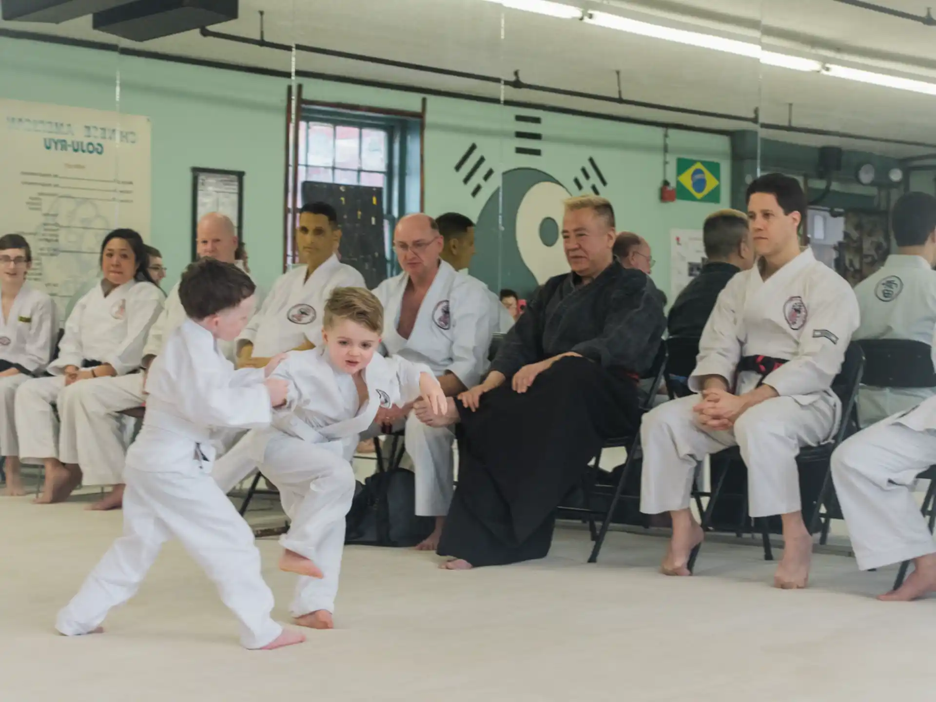 a group of people in white karate uniforms