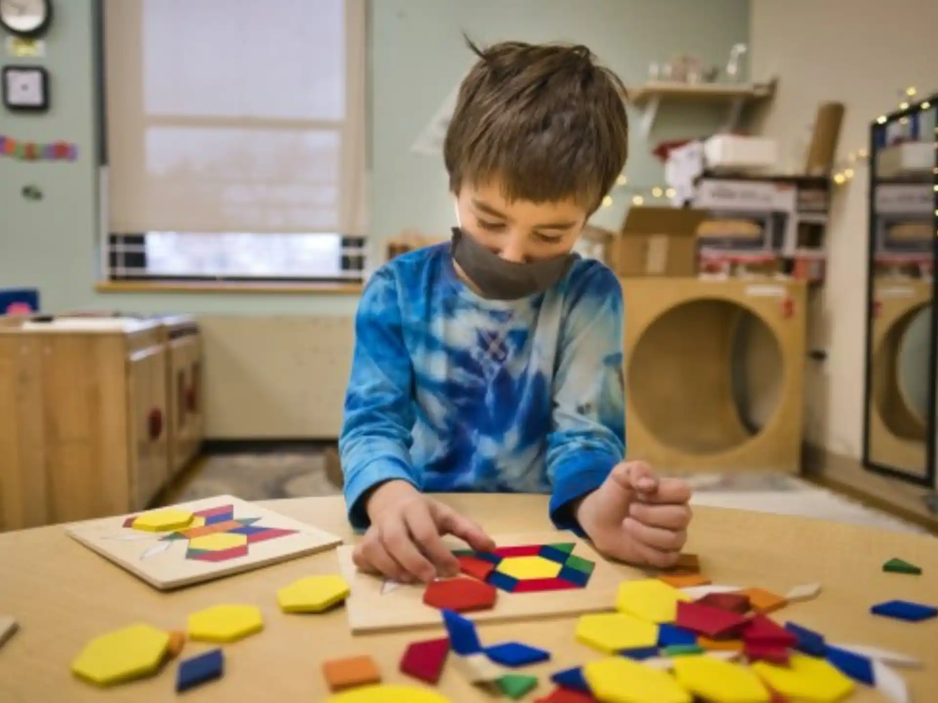 a boy playing with toys