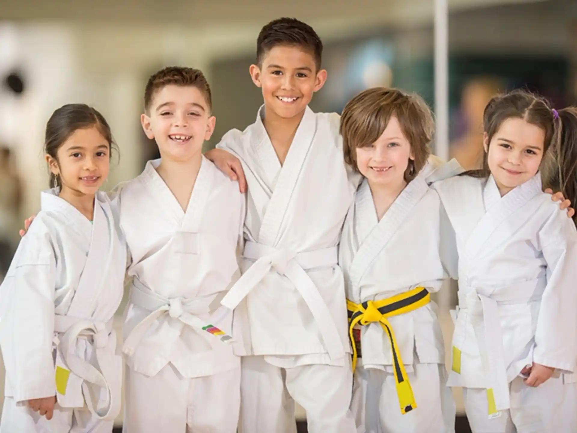 a group of children in white lab coats