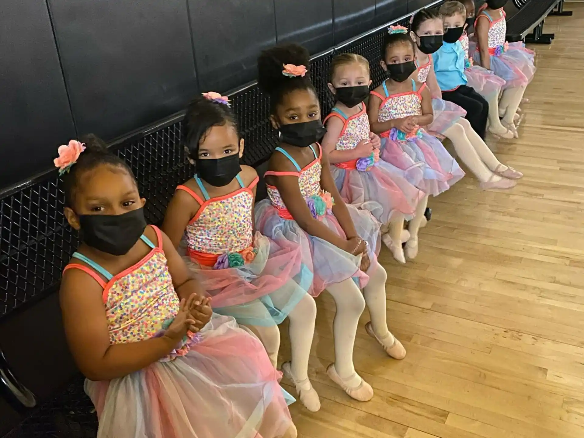 a group of children in dresses