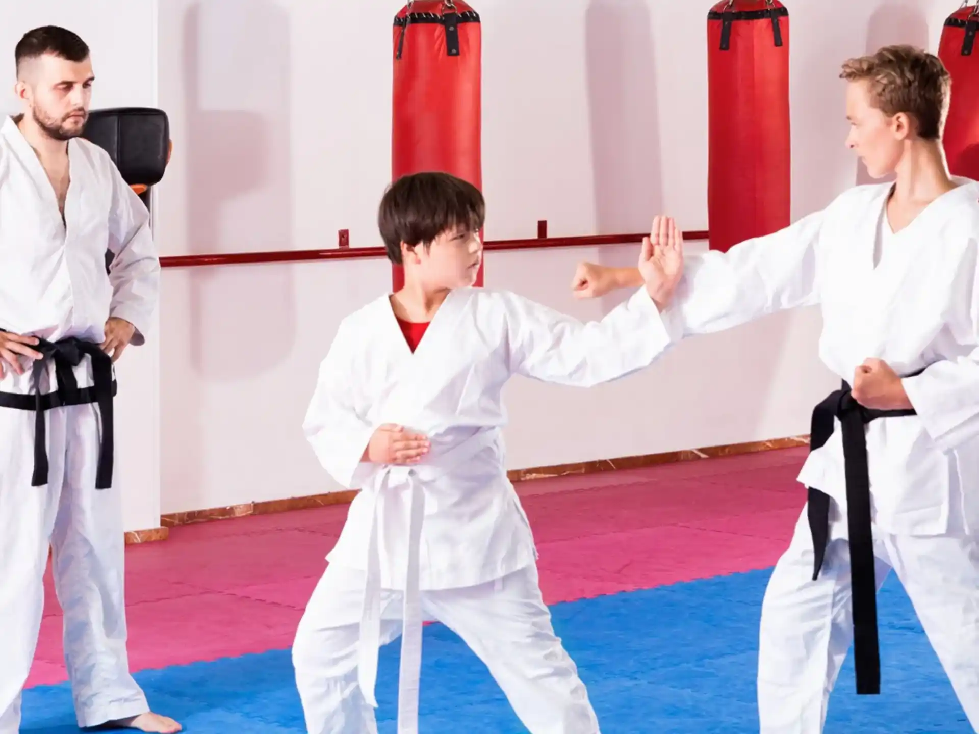 a group of people in karate uniforms