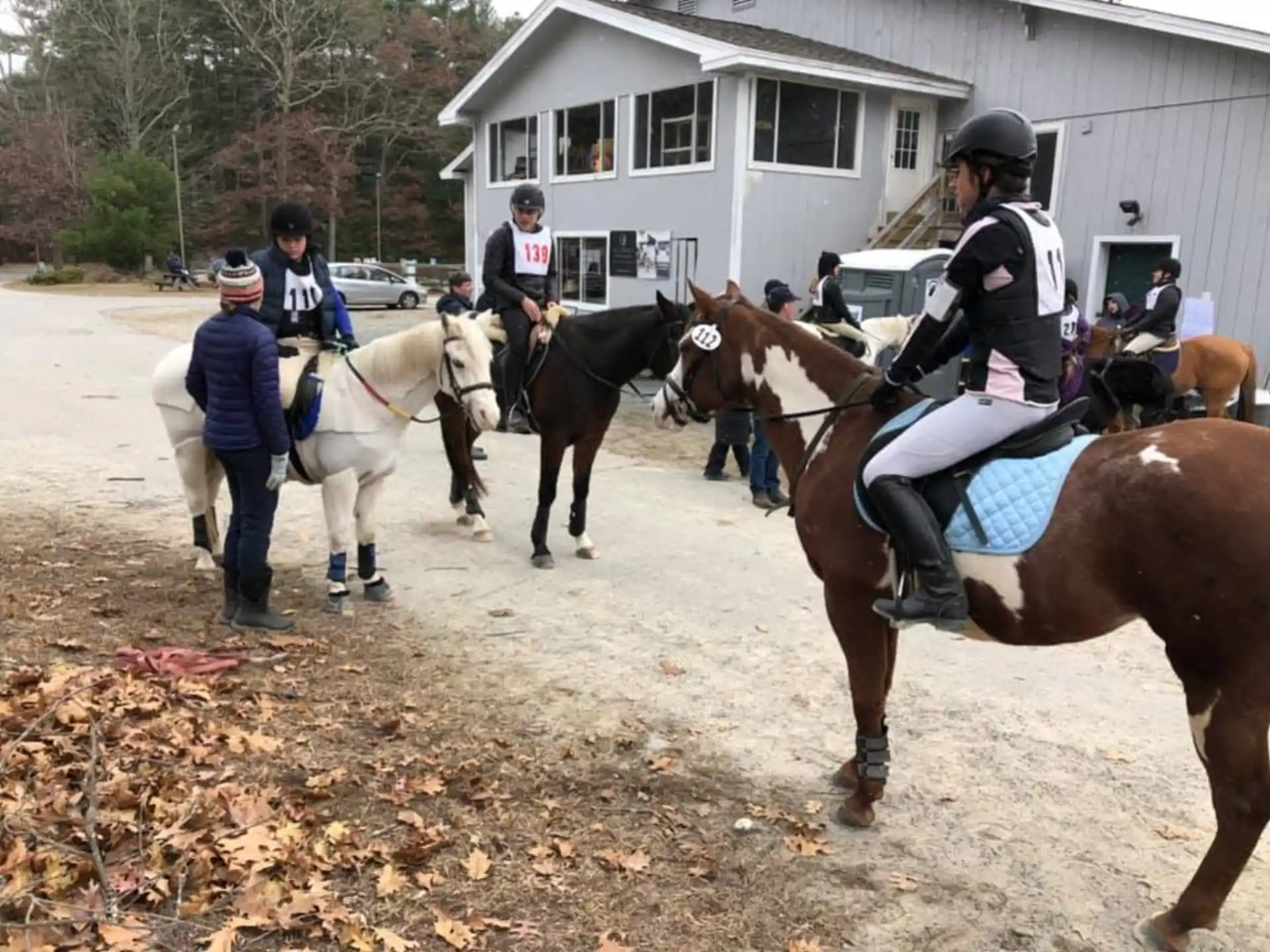 a group of people riding horses