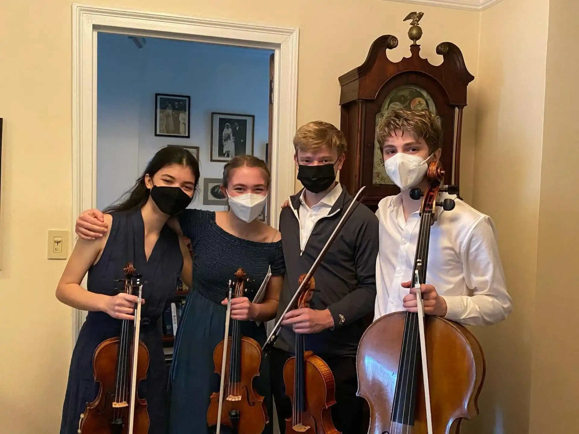 a group of people holding instruments