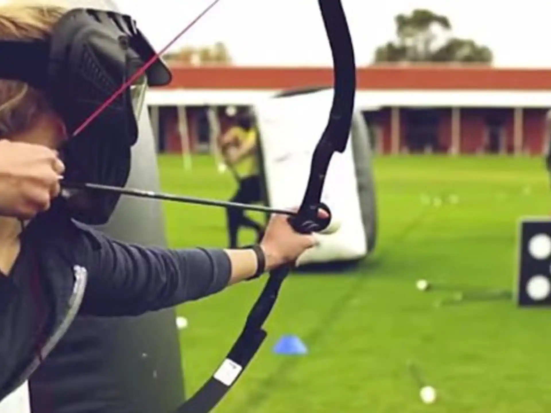 a person swinging a golf club