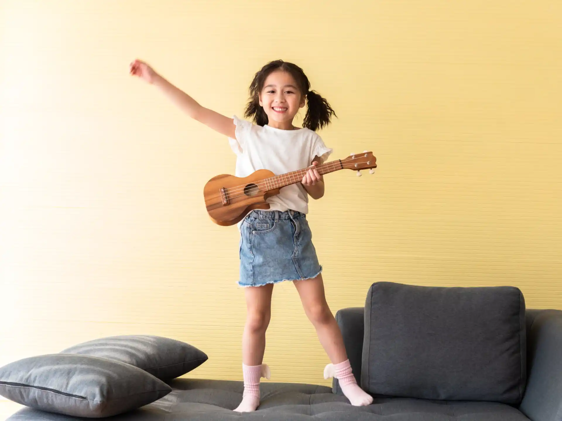 a girl holding a guitar