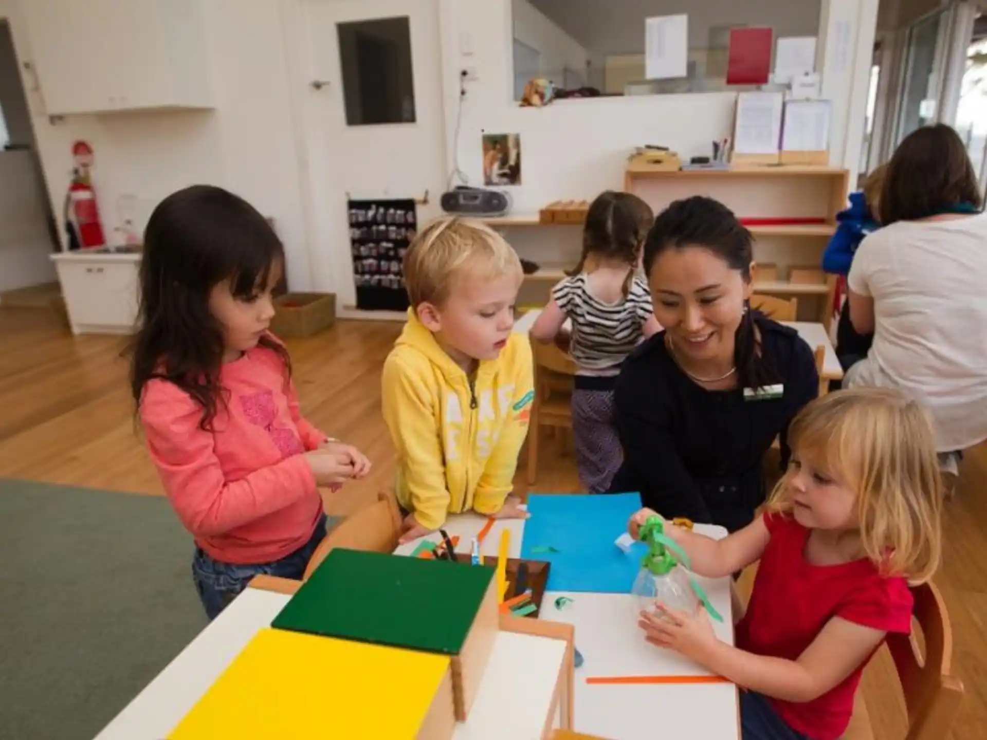 a group of children playing with toys