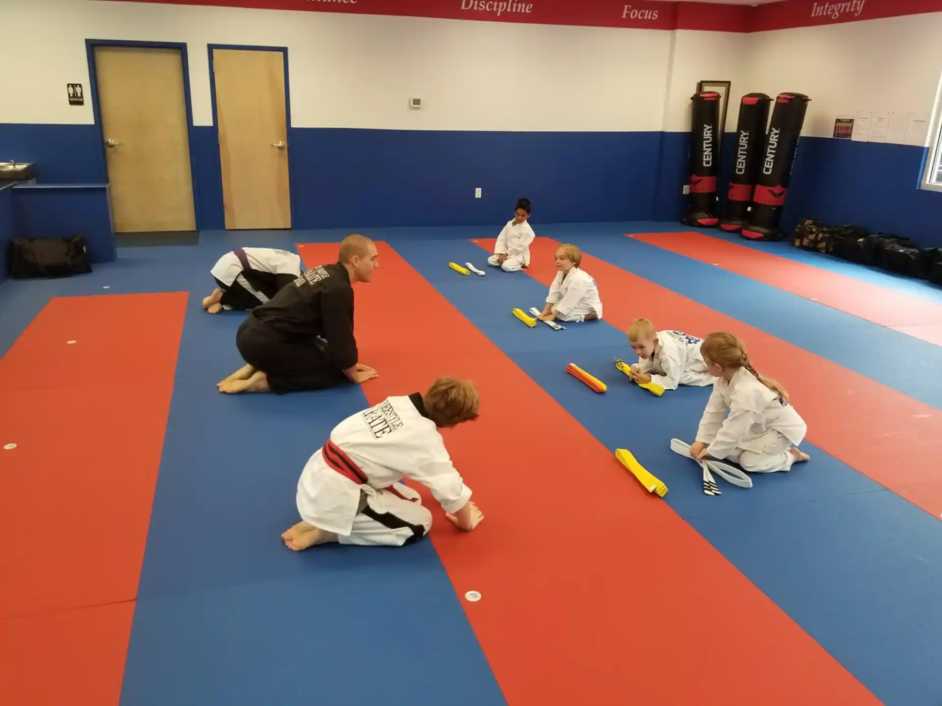 a group of people in a karate class