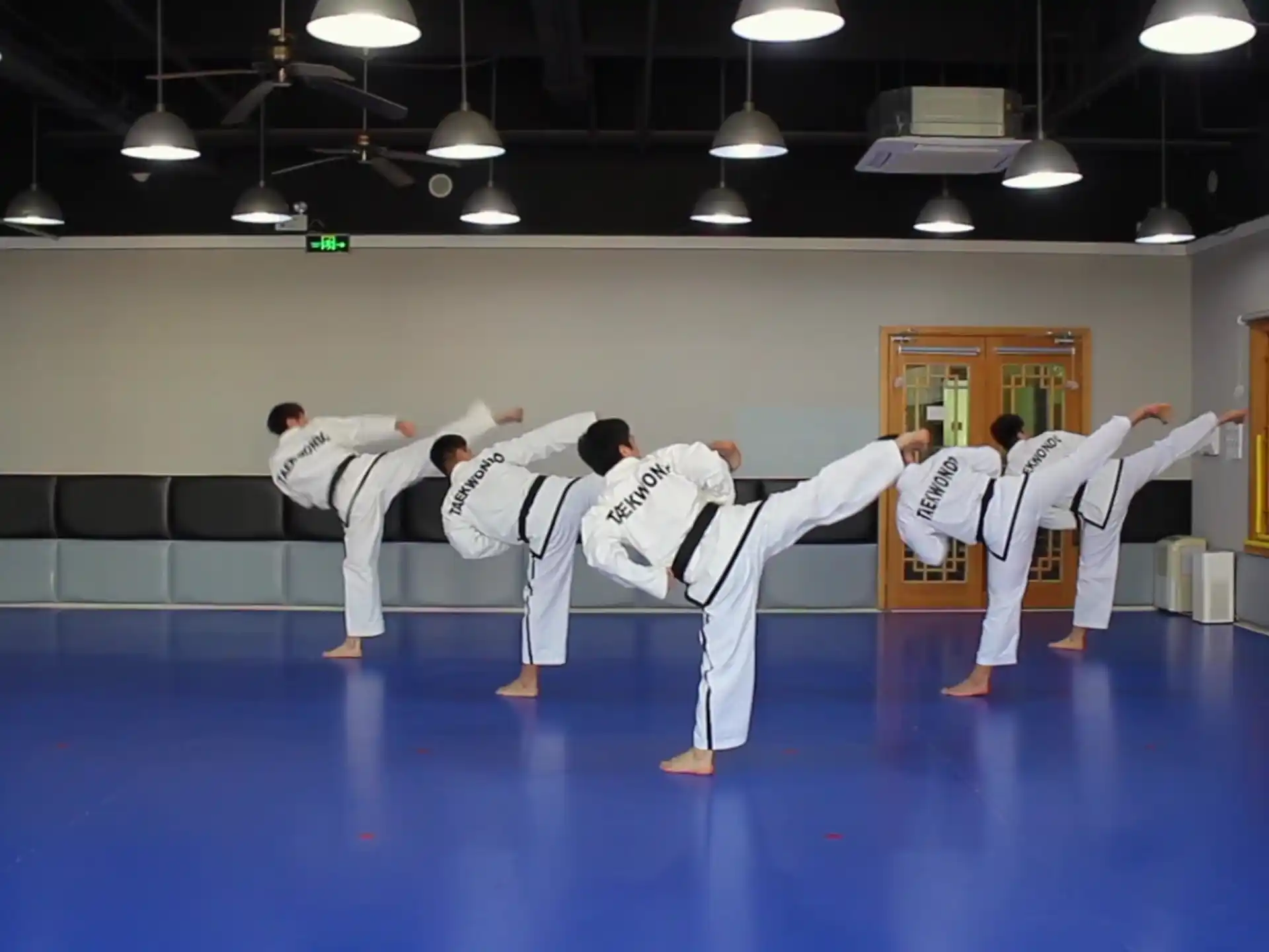 a group of people in karate uniforms