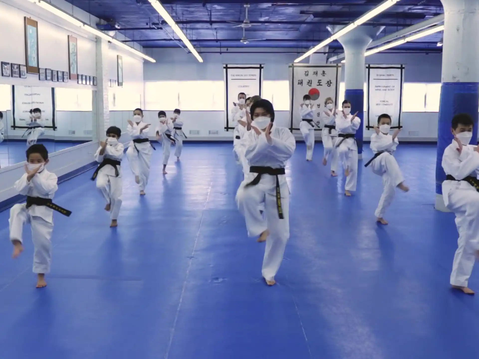 a group of people in karate uniforms
