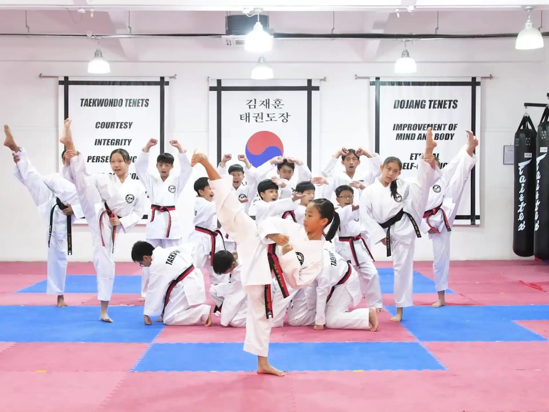 a group of people in karate uniforms