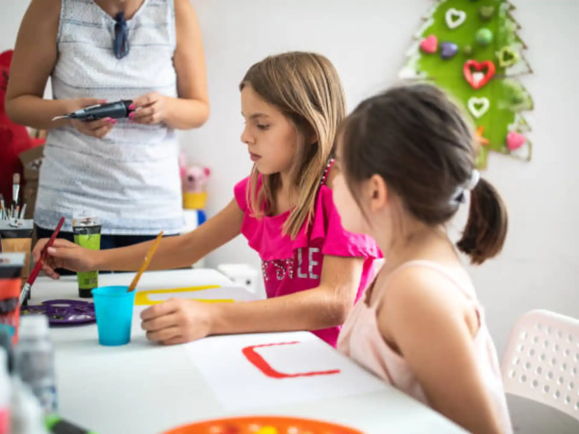 a few young girls painting