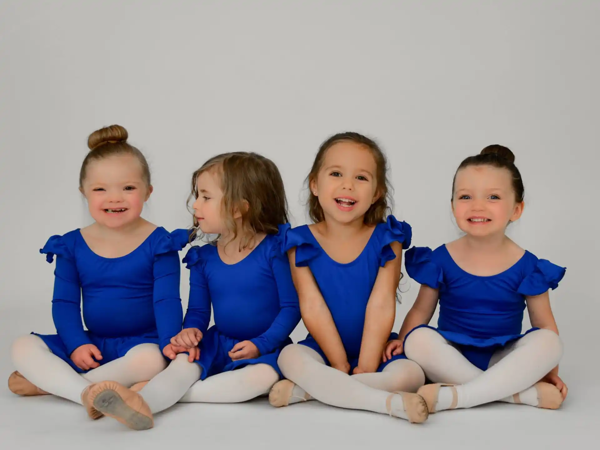 a group of children sitting on the floor