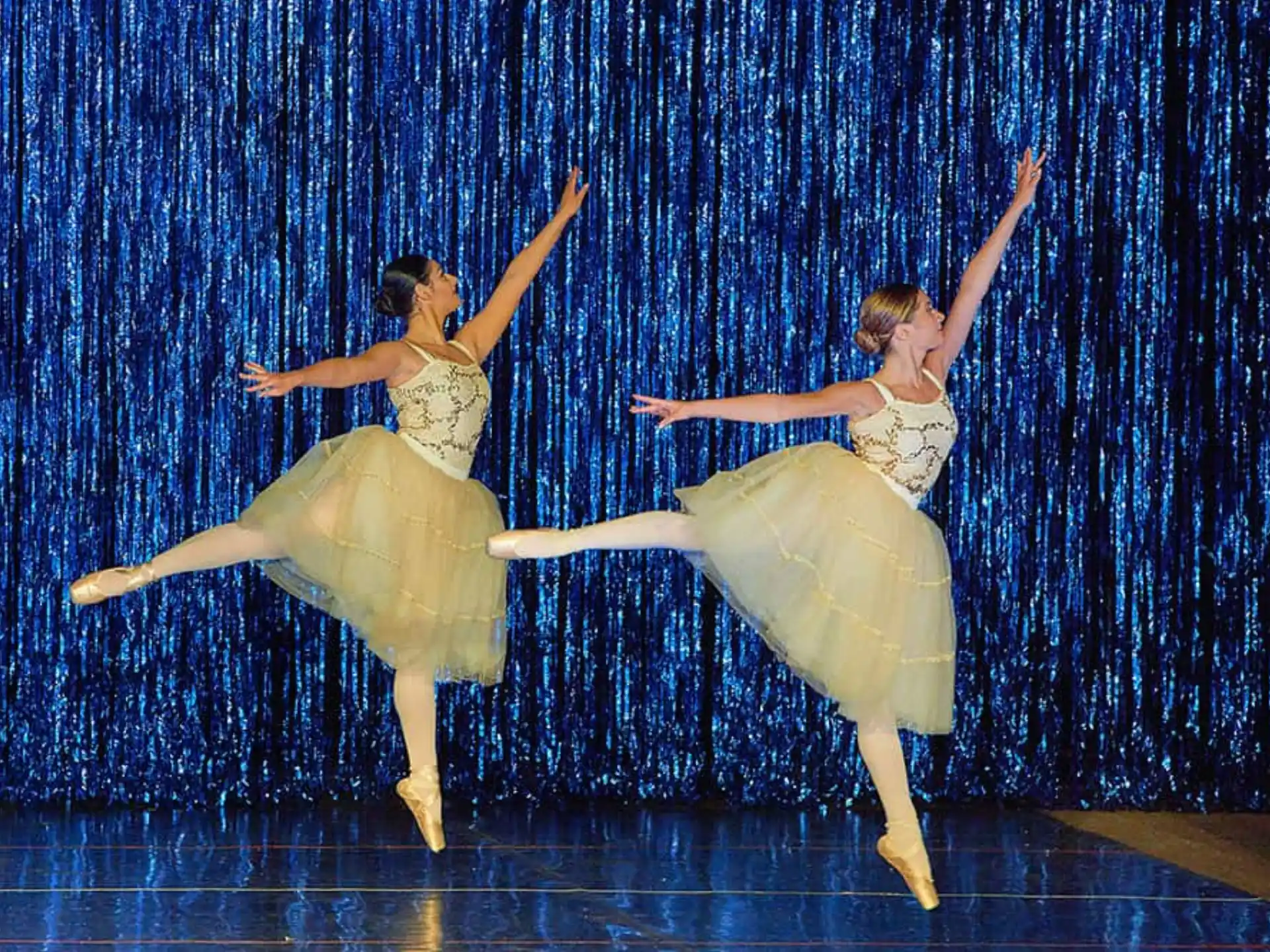 a group of women dancing on a stage