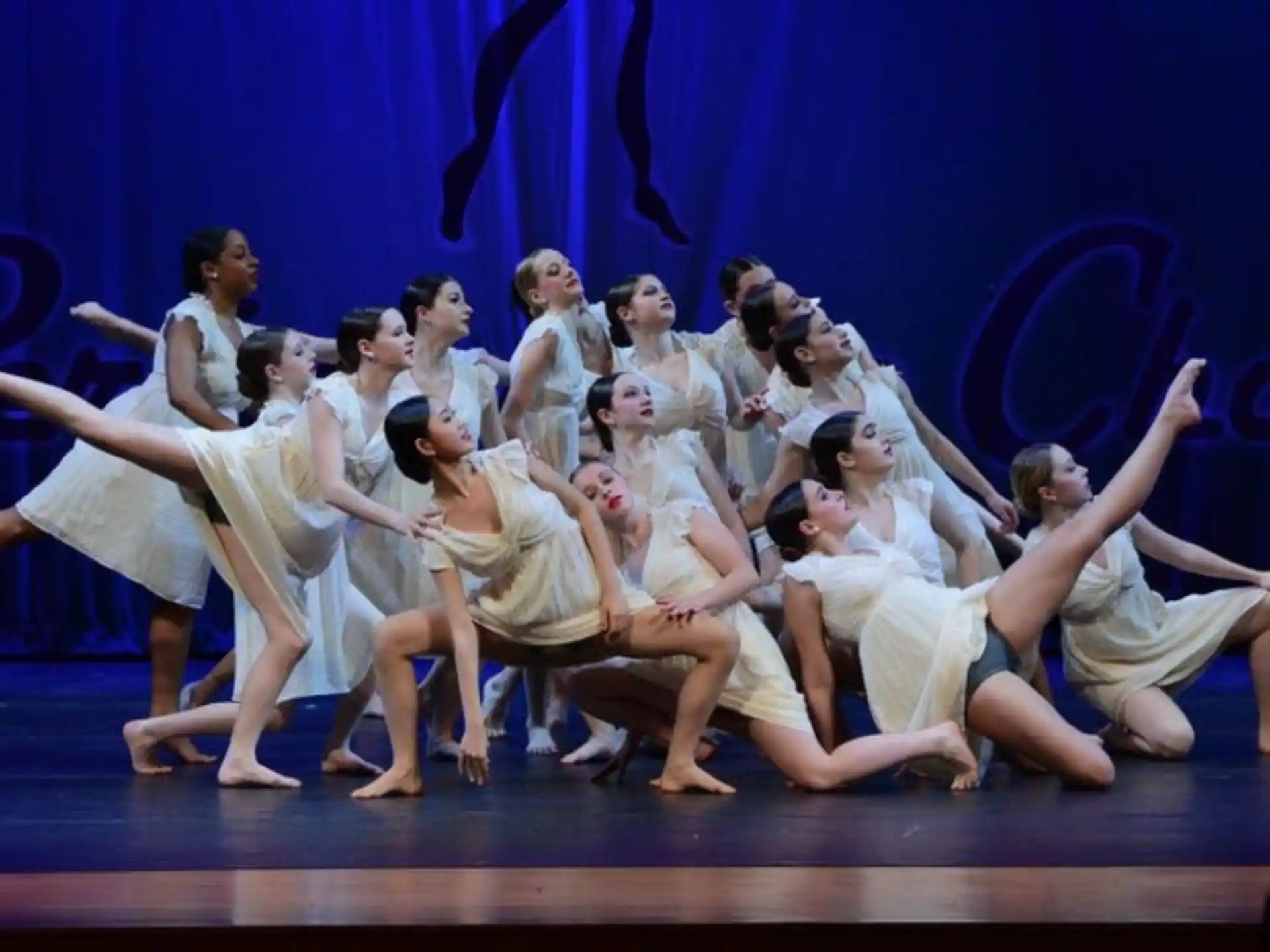 a group of women performing on a stage