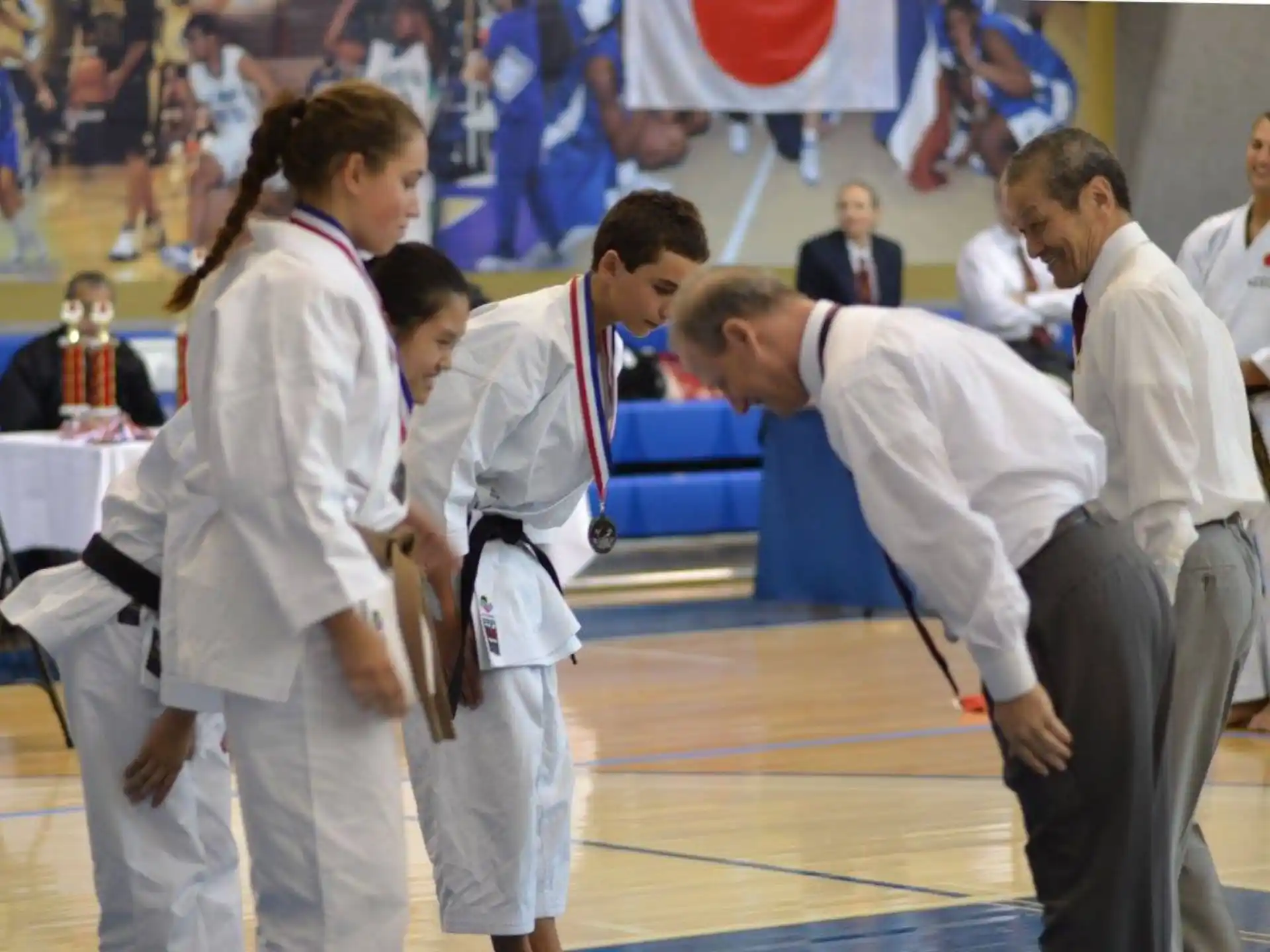 a group of people in karate uniforms