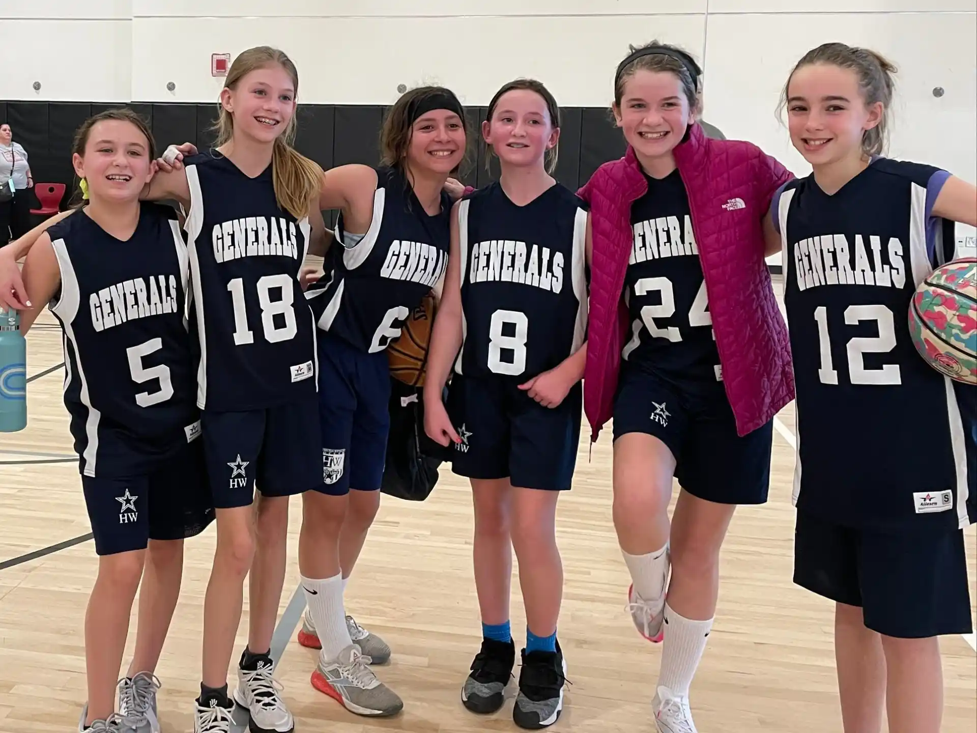 a group of girls in athletic uniforms