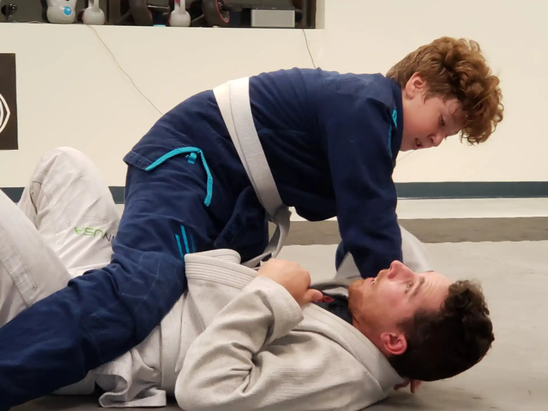 a man lying on a man's back