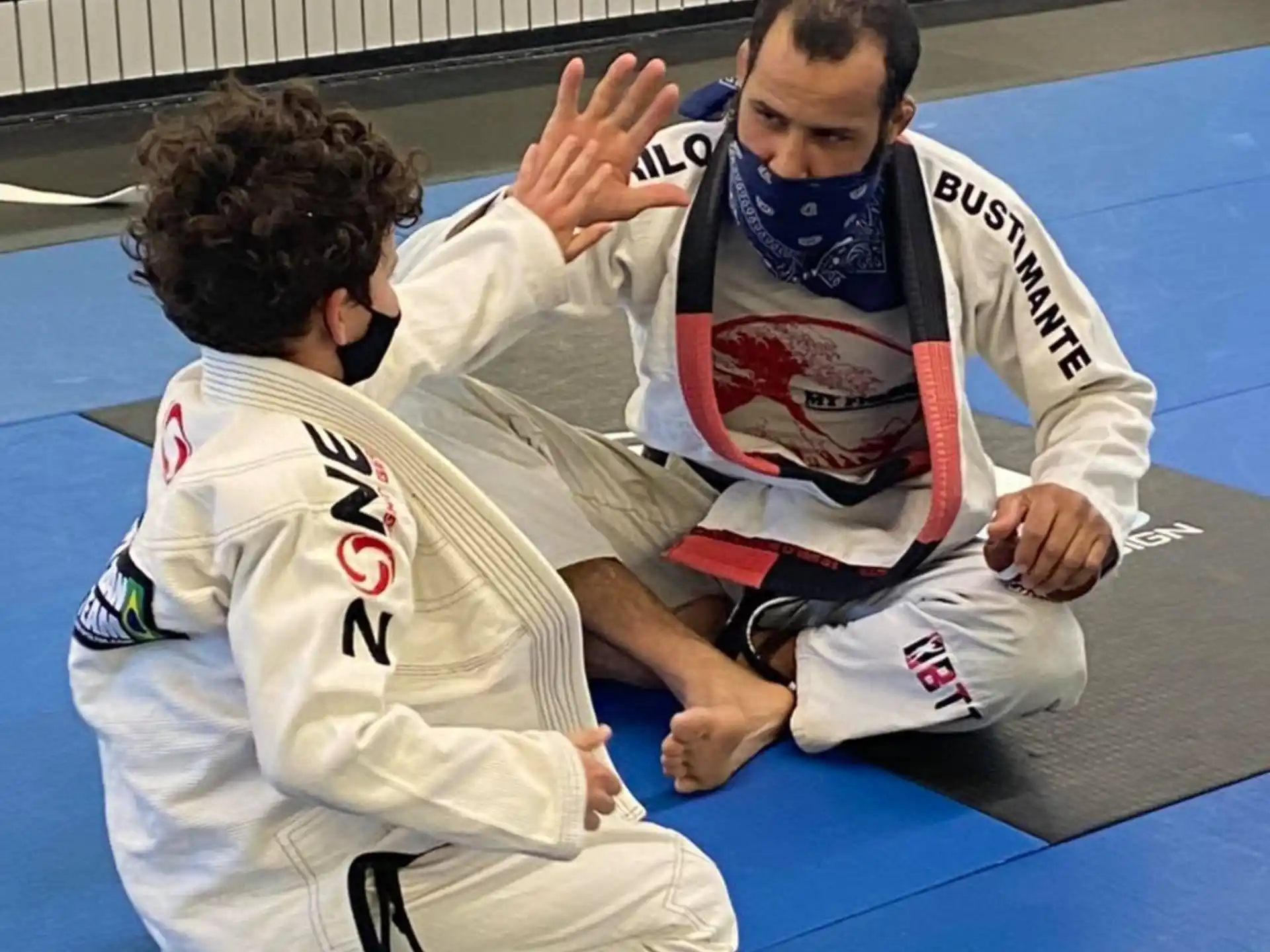a man and a woman in karate uniforms