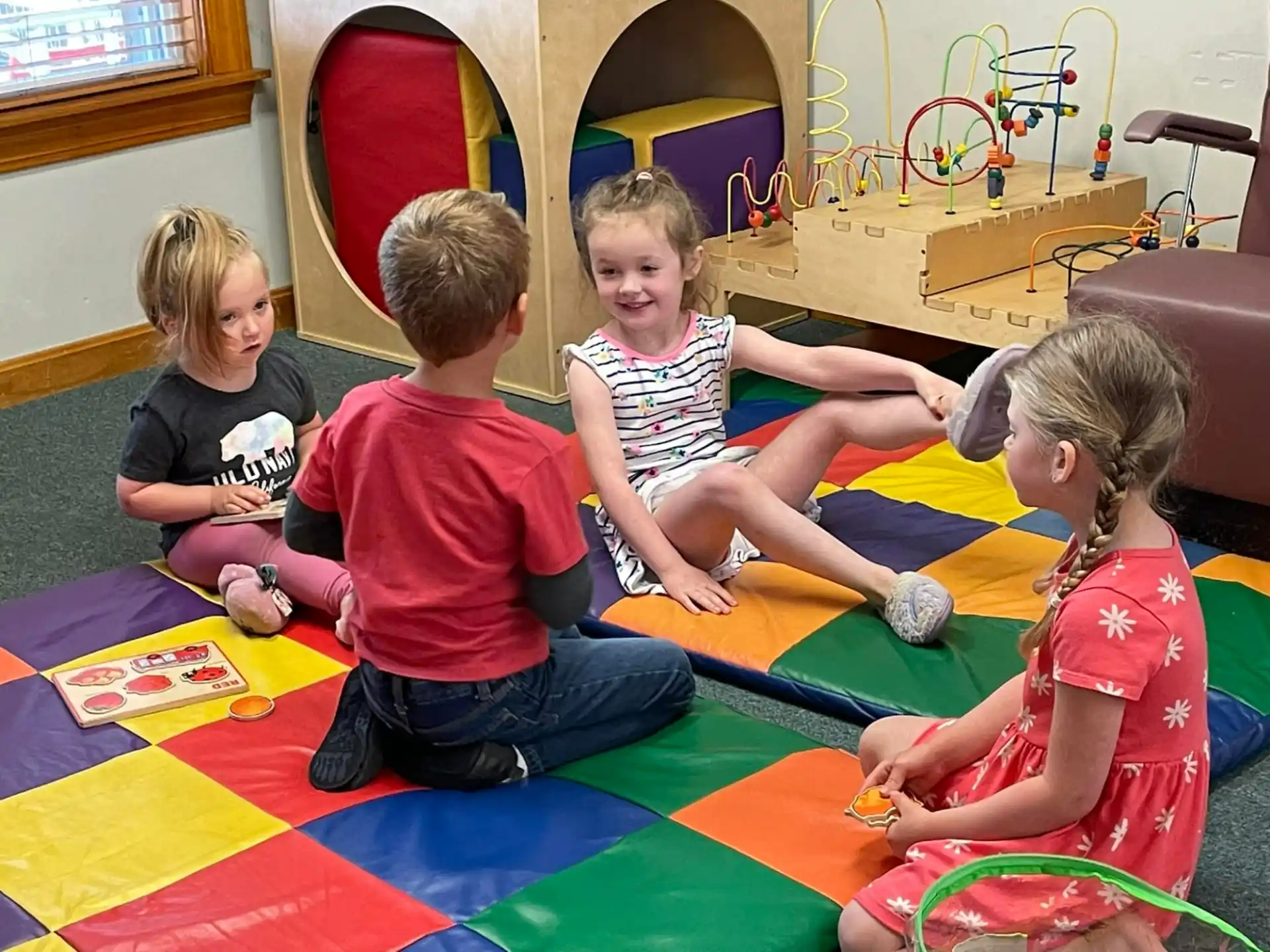 a group of children sitting on the floor