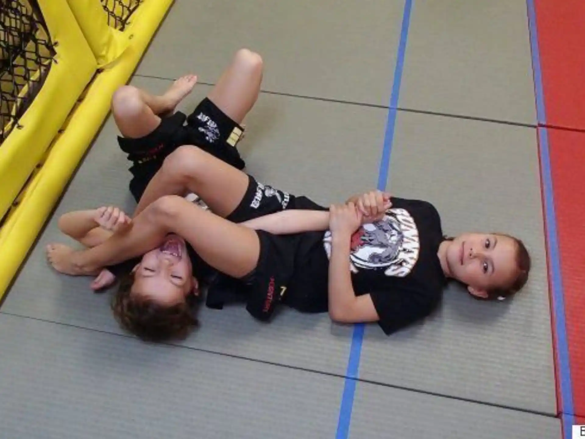 a person and a baby lying on the ground