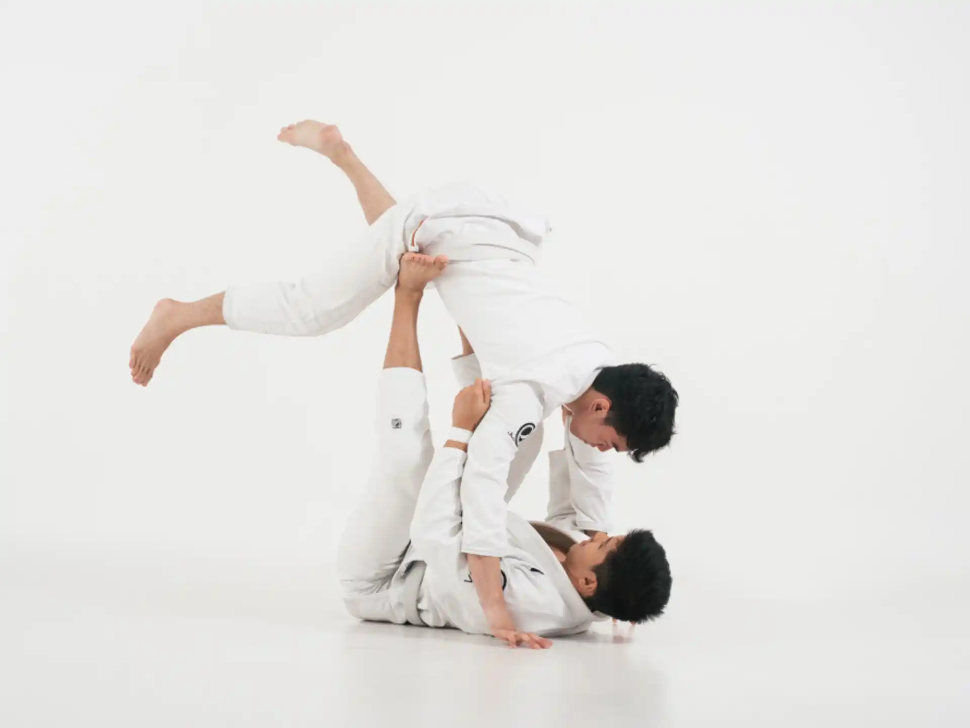 a man kicking another man