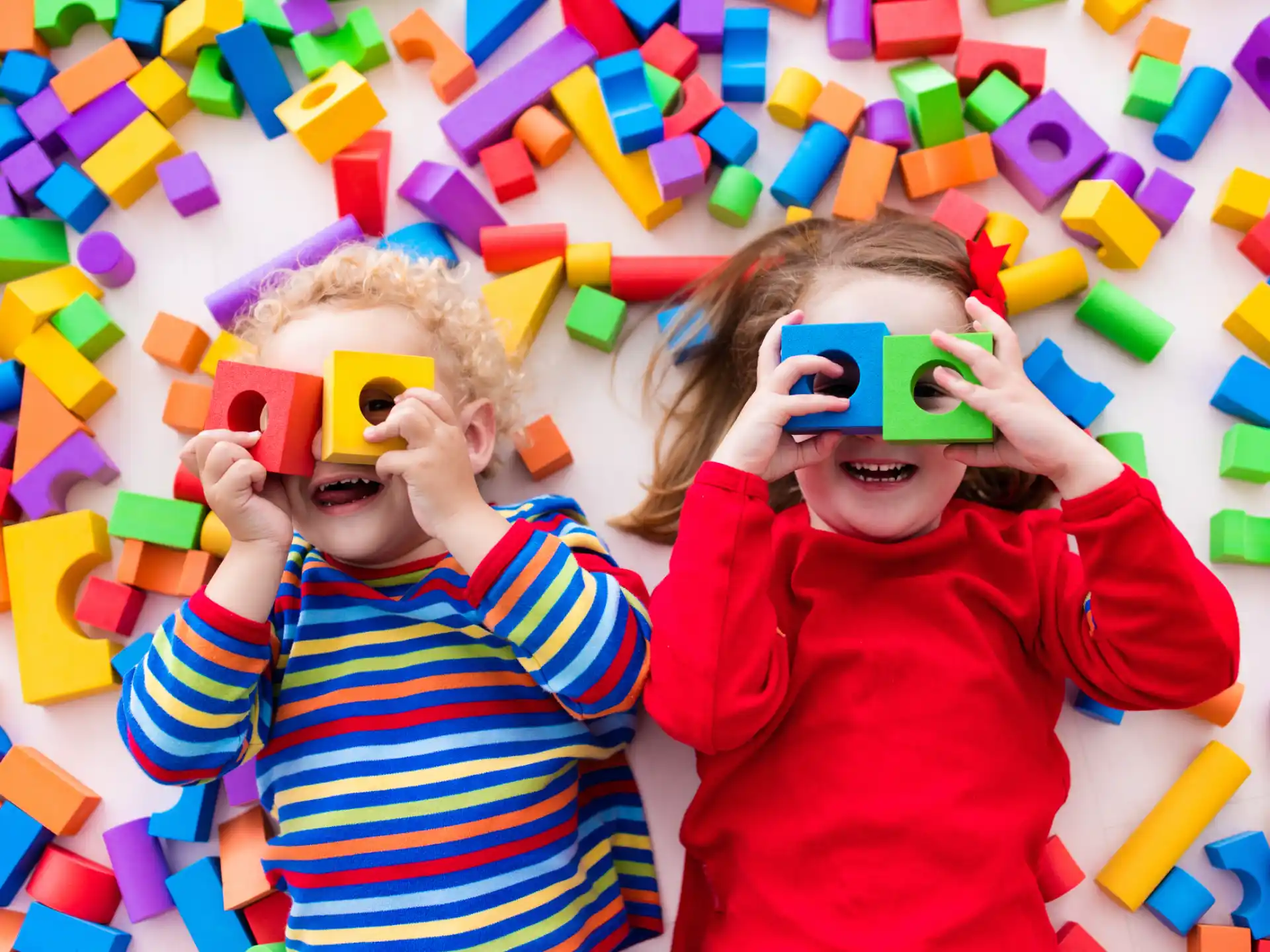 a couple of children wearing masks