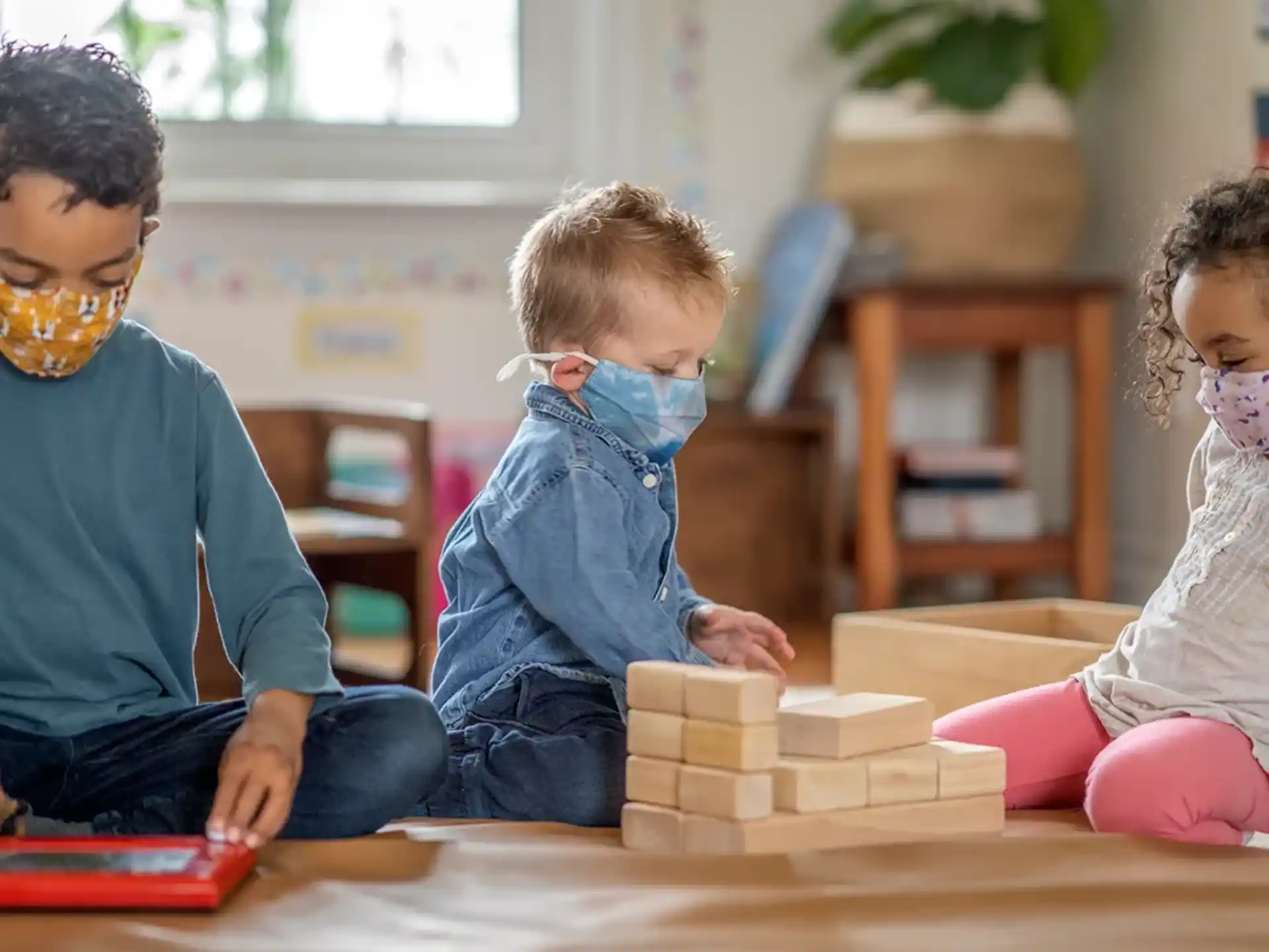 a few children playing with blocks