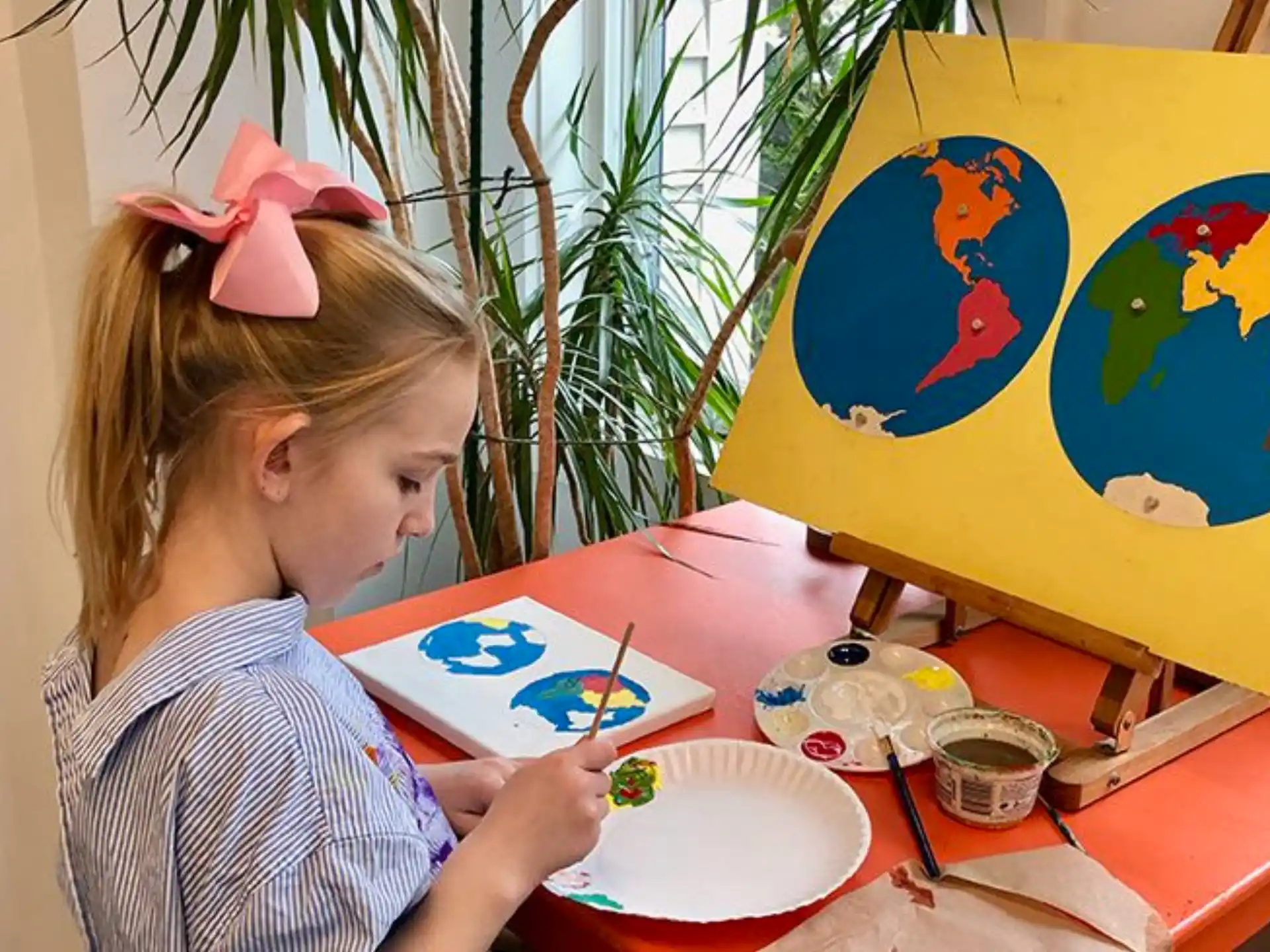 a young girl painting