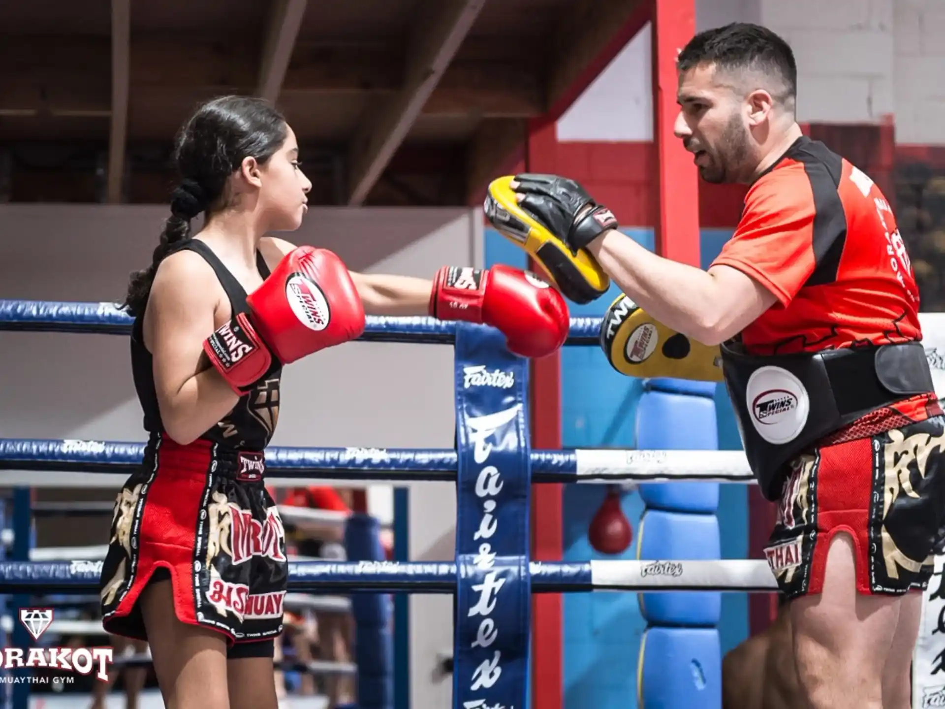 a man and woman in boxing gloves