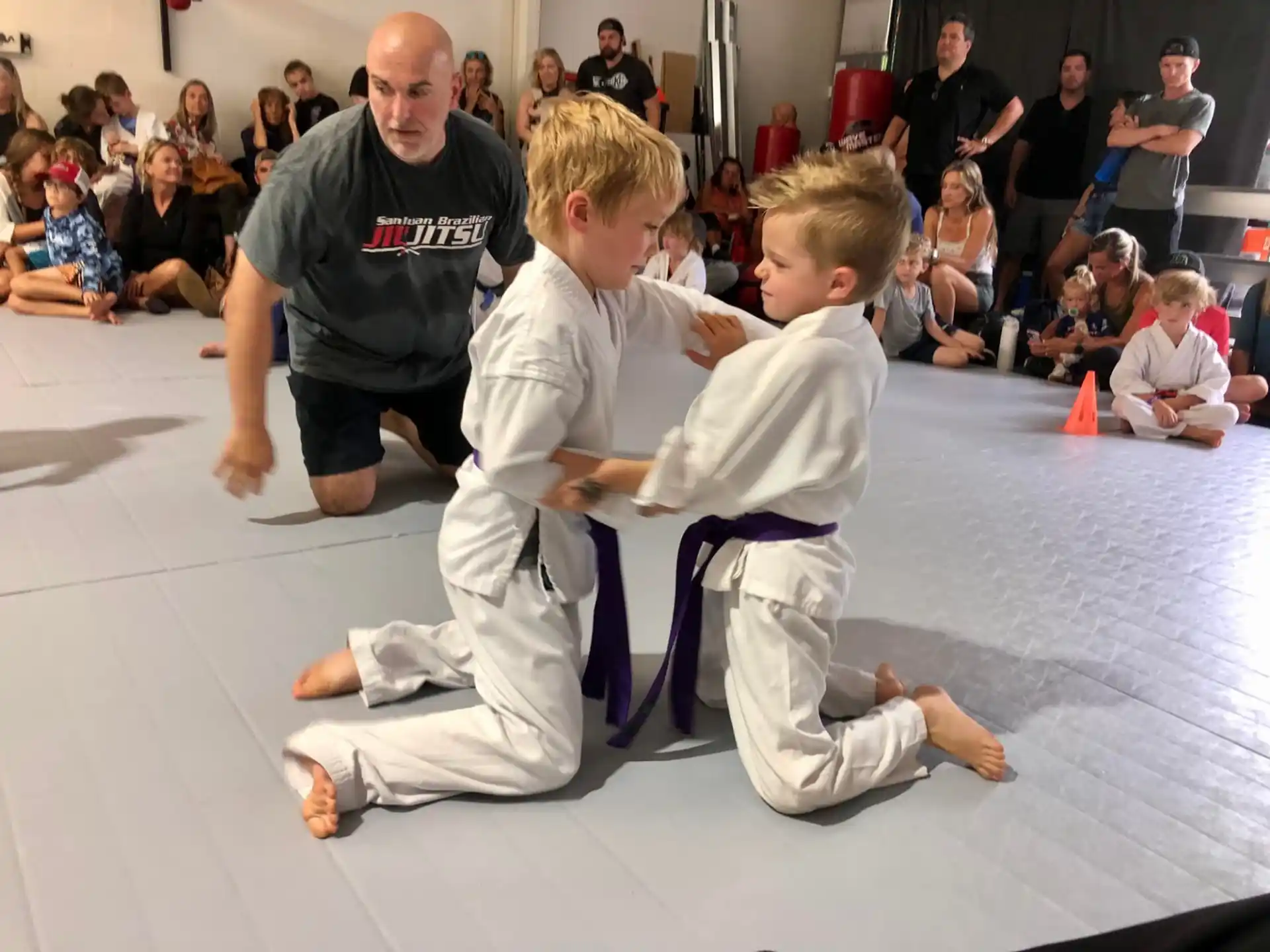 a group of people in karate uniforms