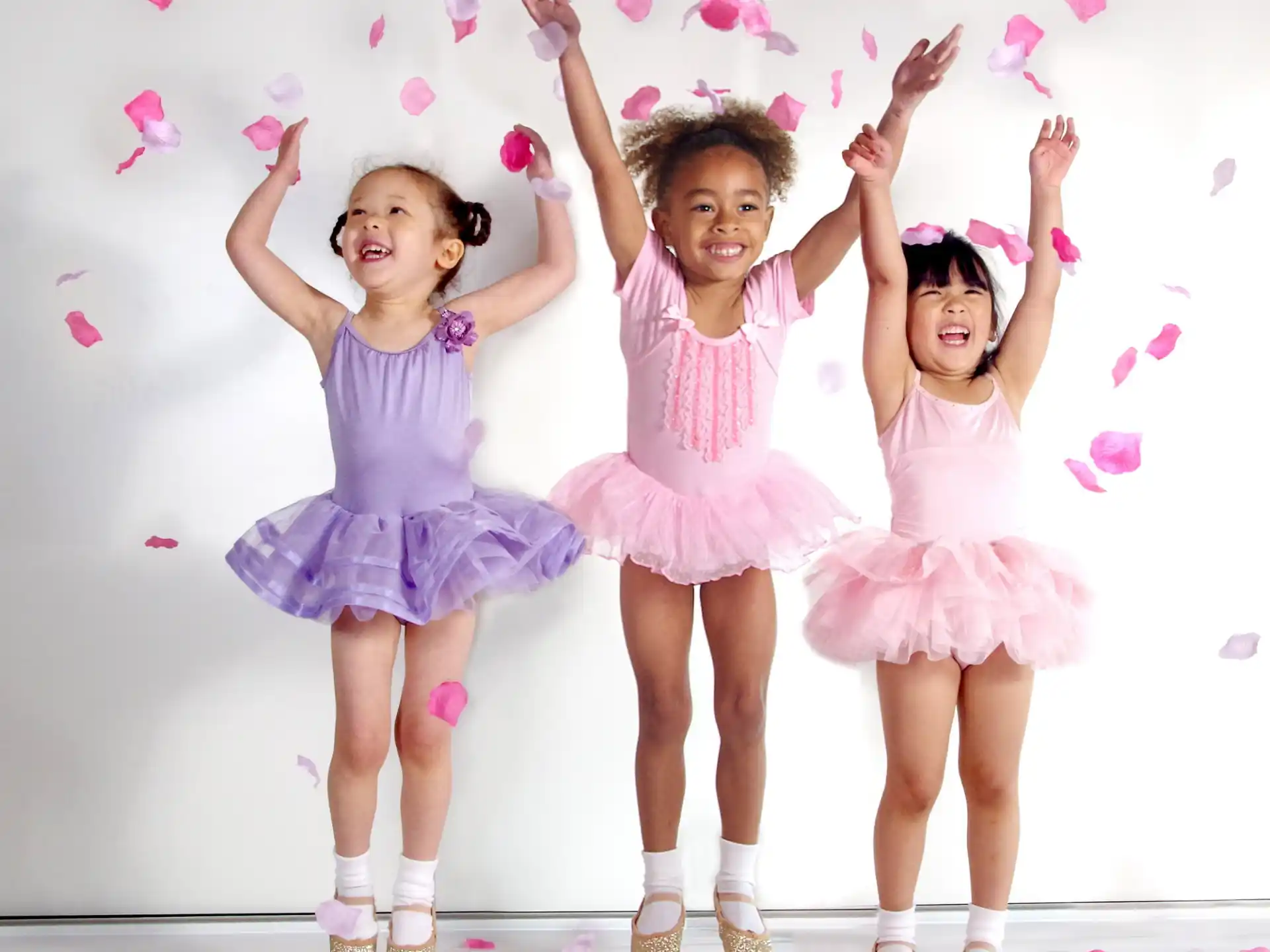 a group of girls in dresses