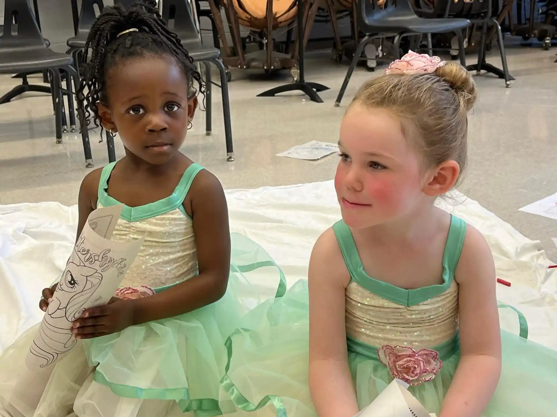 a couple of girls in dresses
