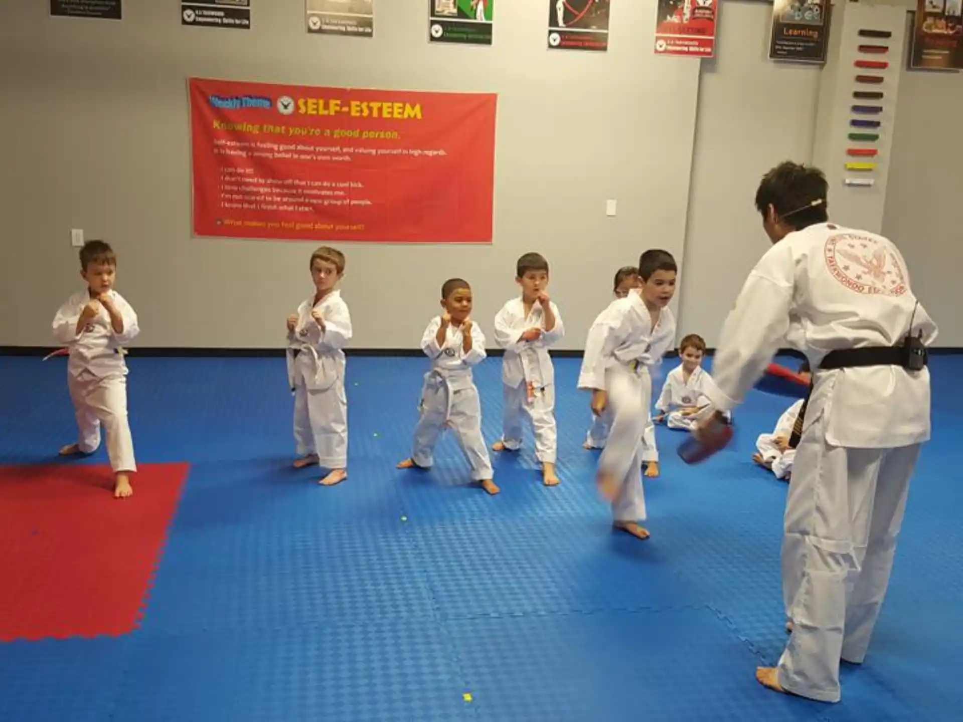 a group of kids in karate uniforms
