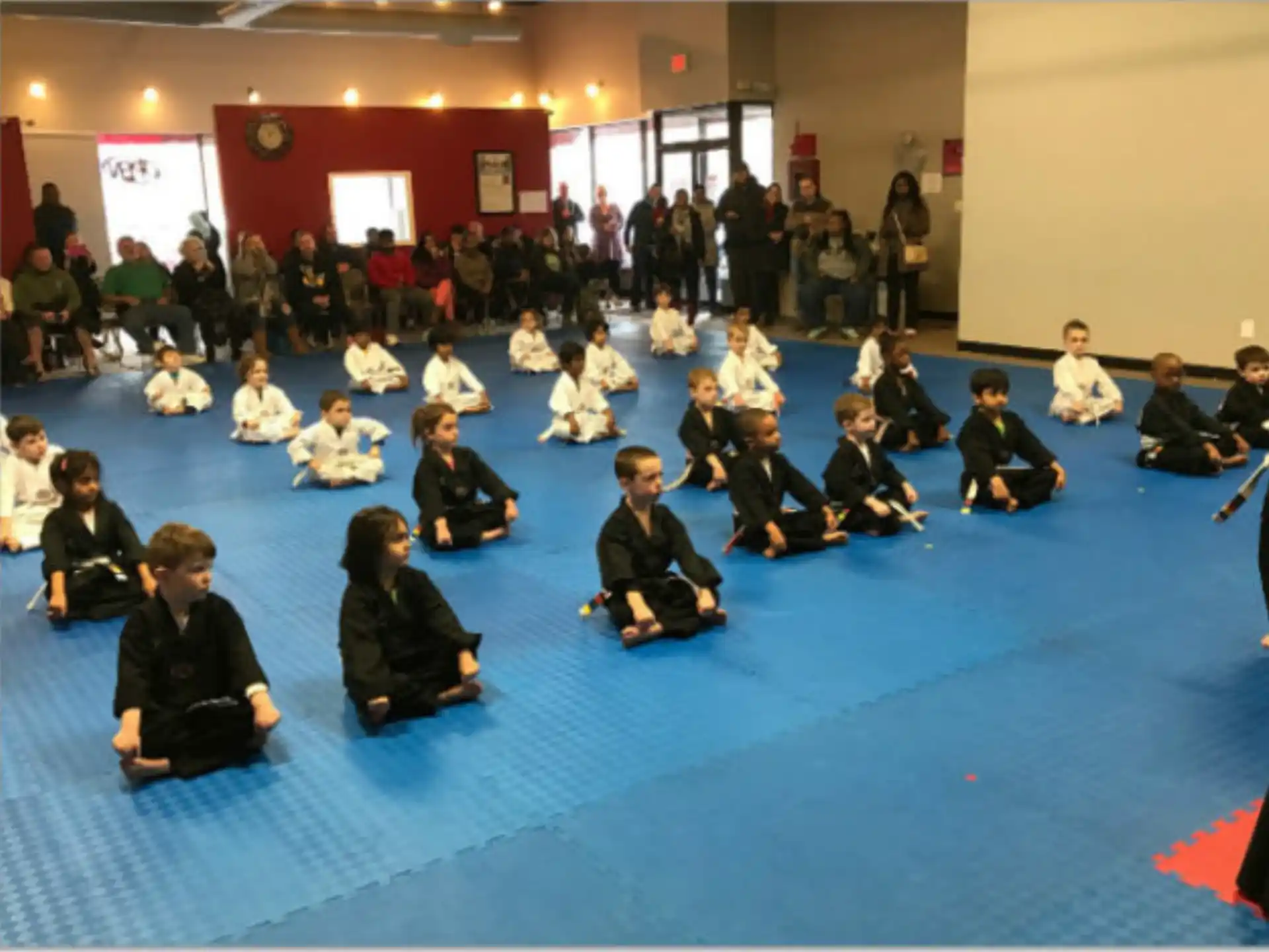 a group of people sitting on the floor