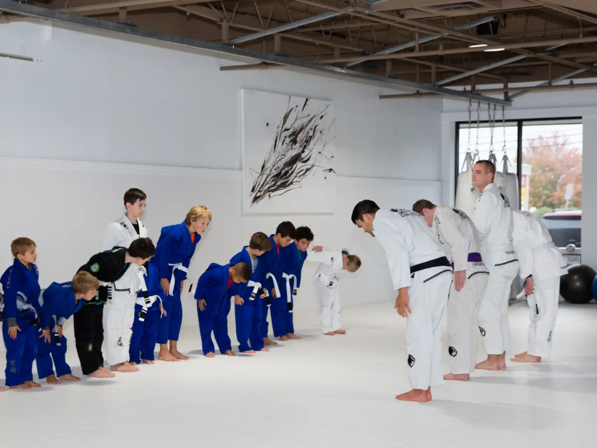 a group of people in karate uniforms