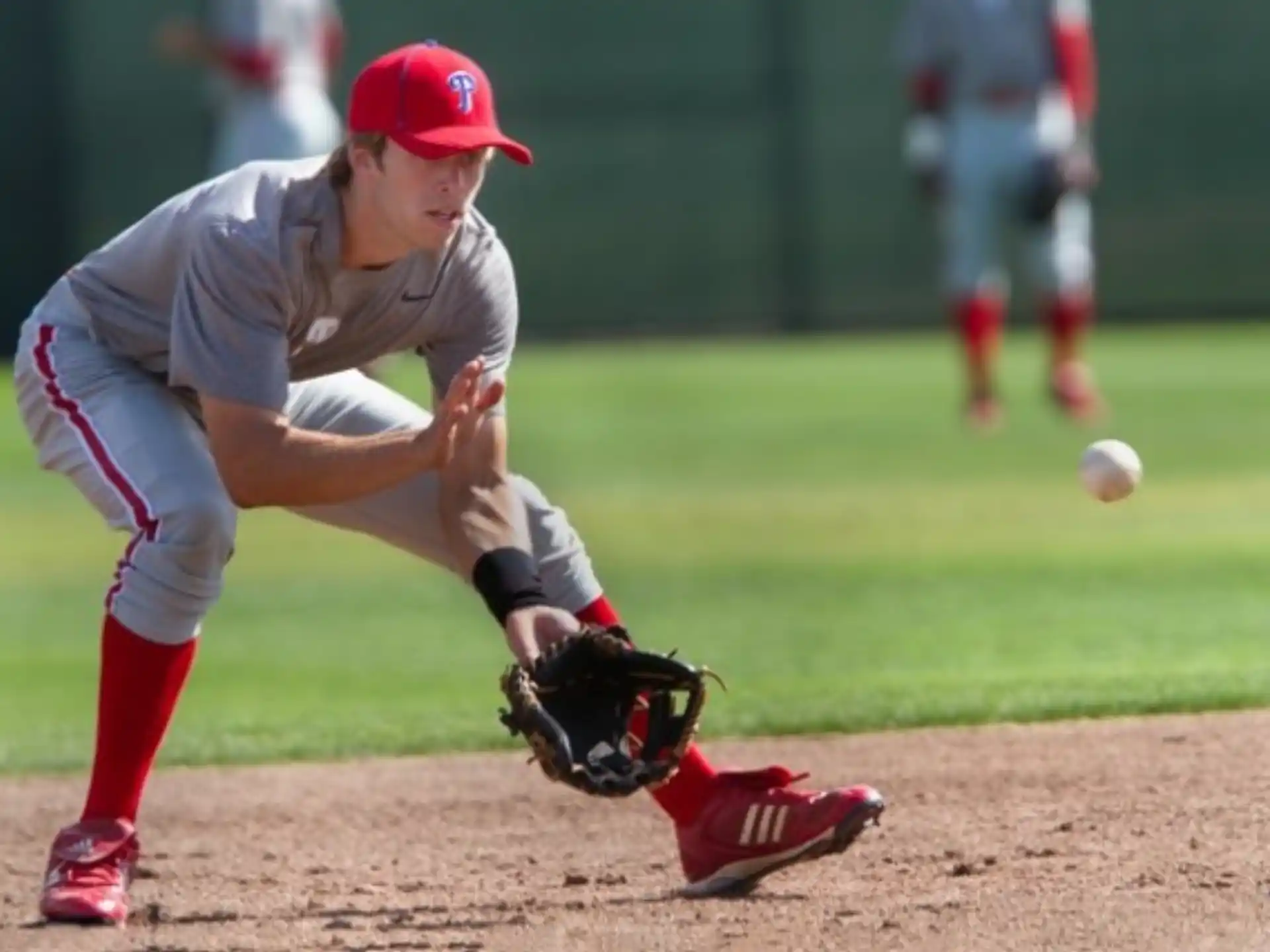 a baseball player catching a ball