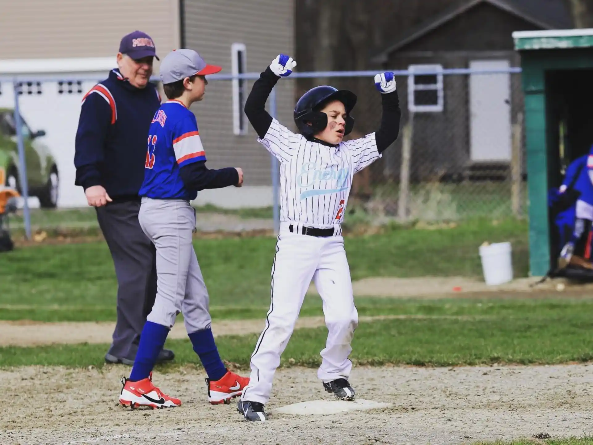 a couple of young boys playing baseball