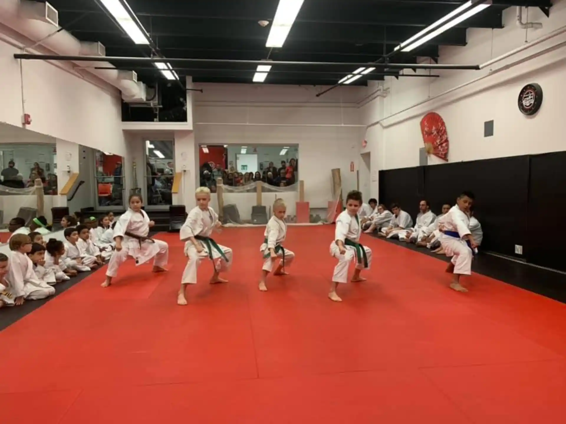 a group of people in karate uniforms