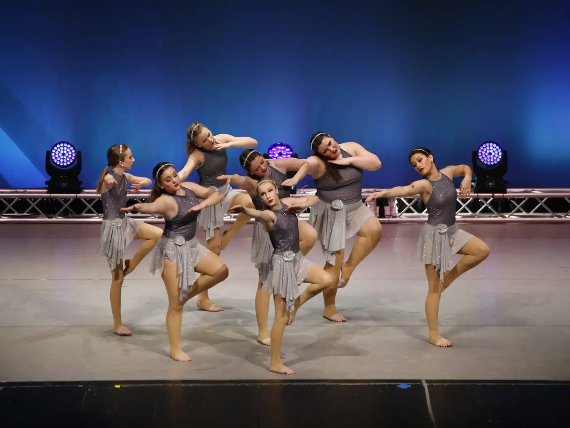a group of women dancing on a stage
