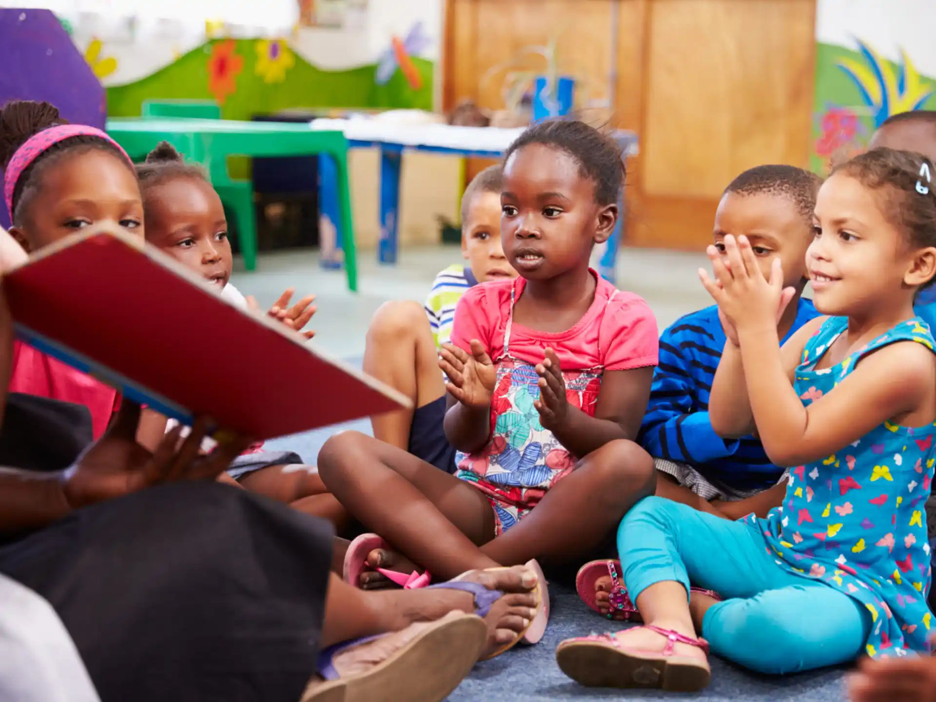 a group of children sitting on the floor