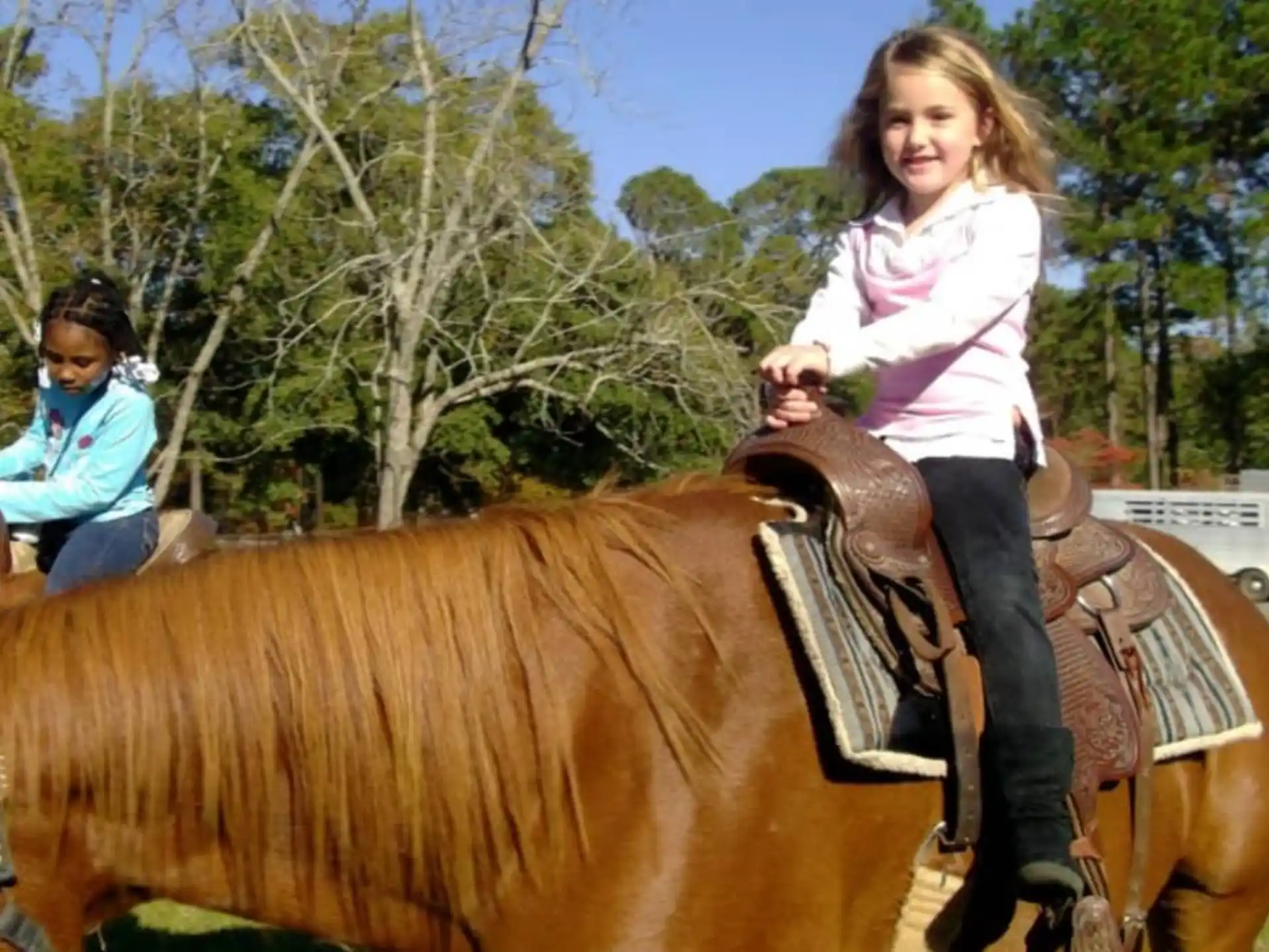 a girl riding a horse