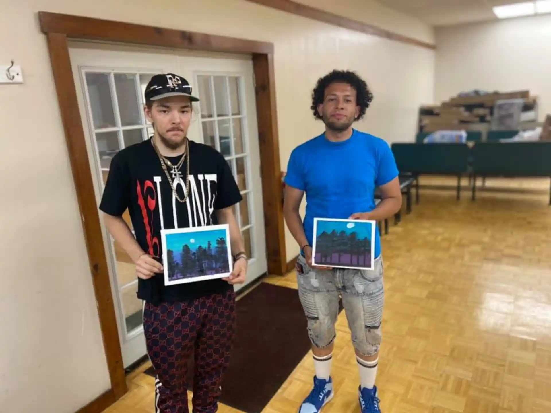 a couple of men holding a plaque