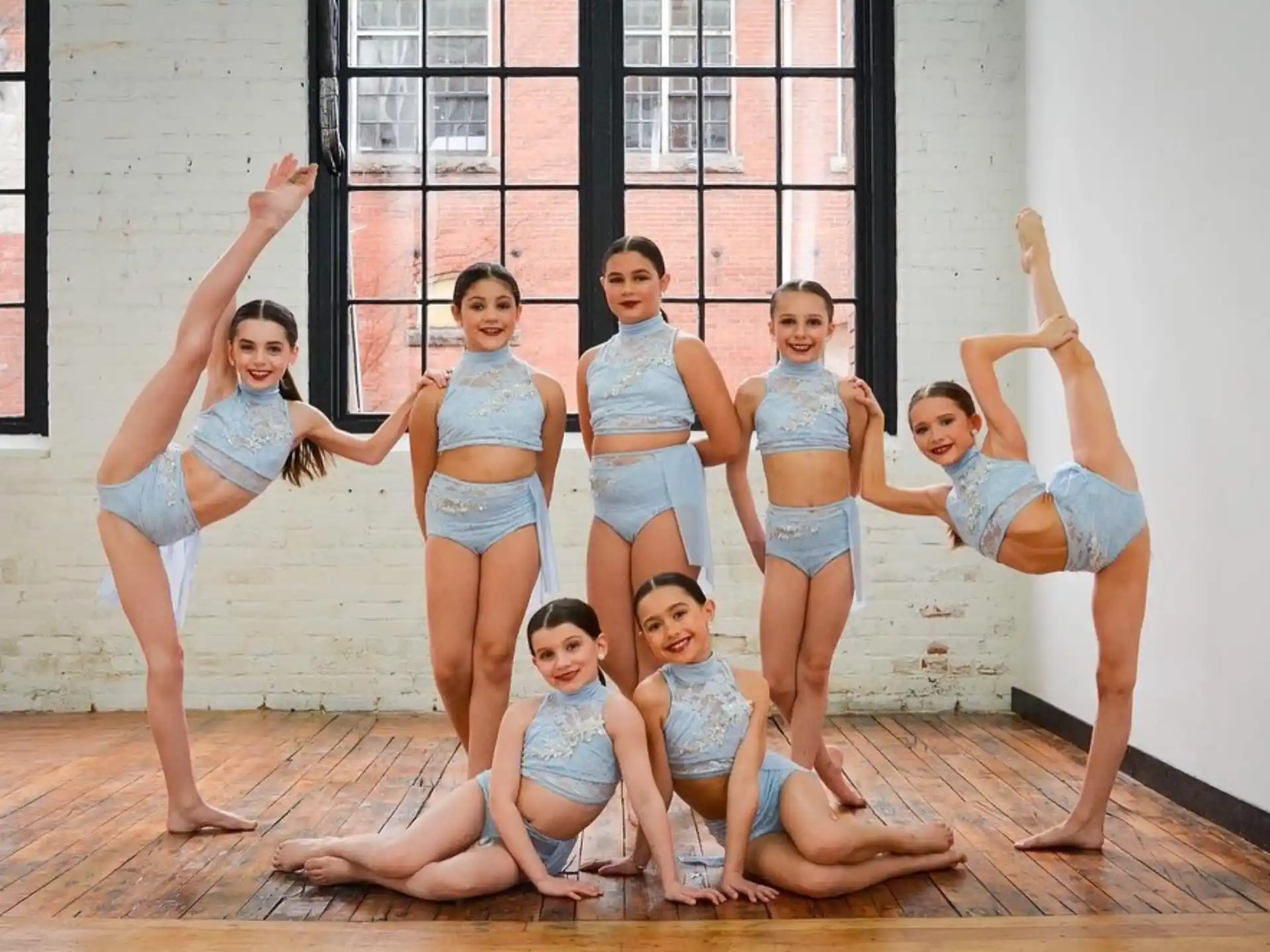 a group of girls posing for a photo