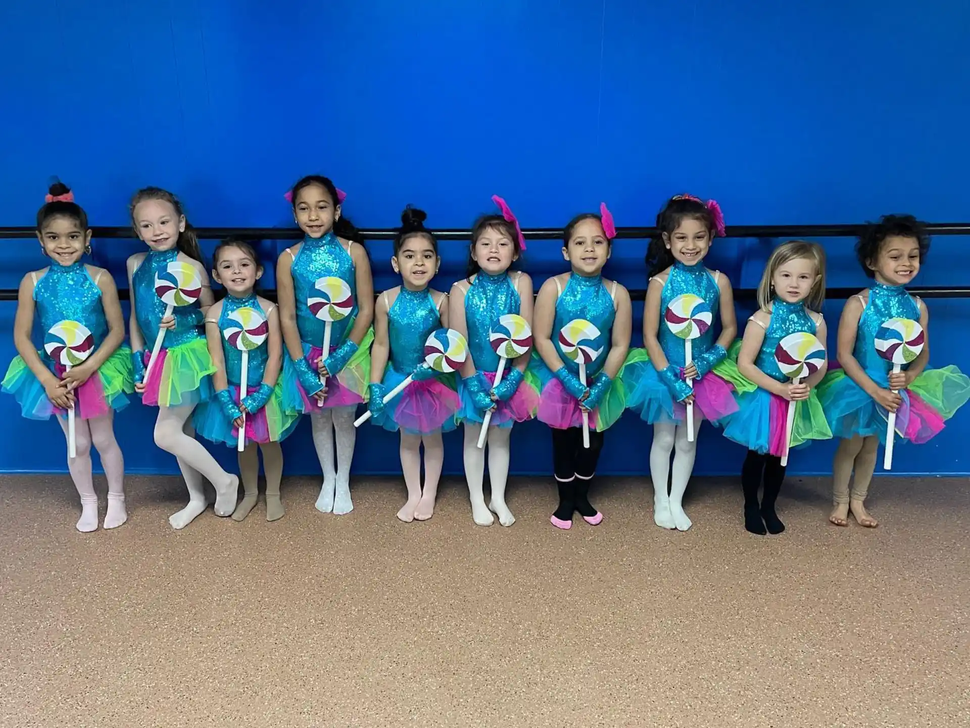 a group of girls in matching outfits